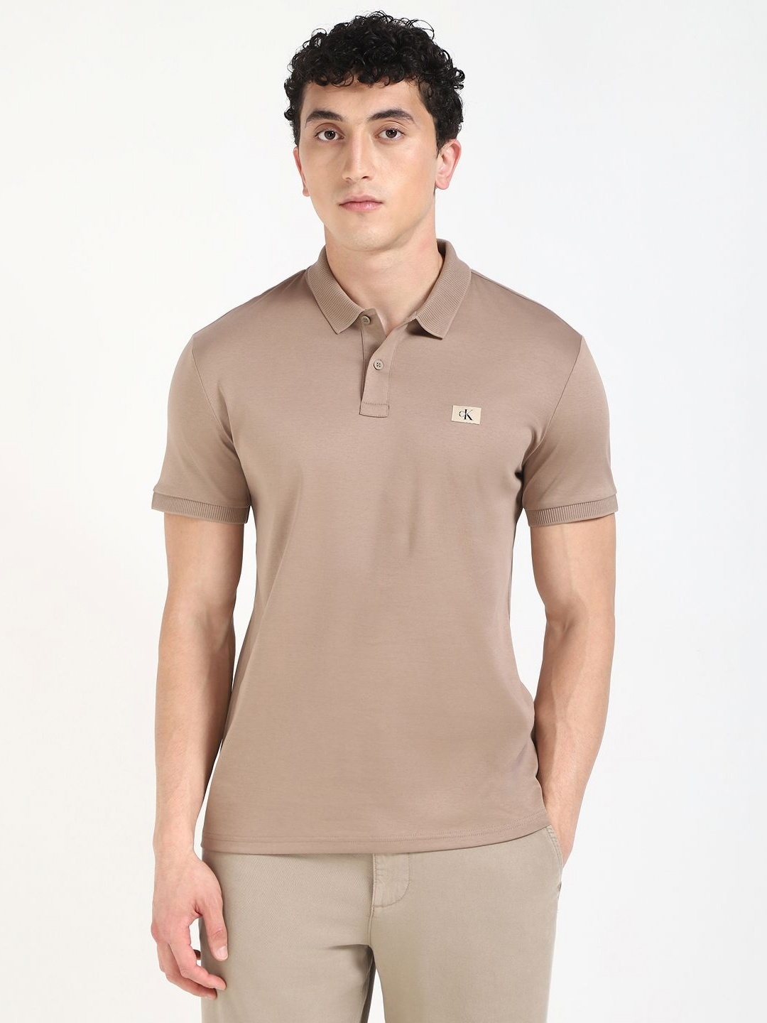 

Calvin Klein Men Solid Polo Collar Cotton T-shirt, Camel brown