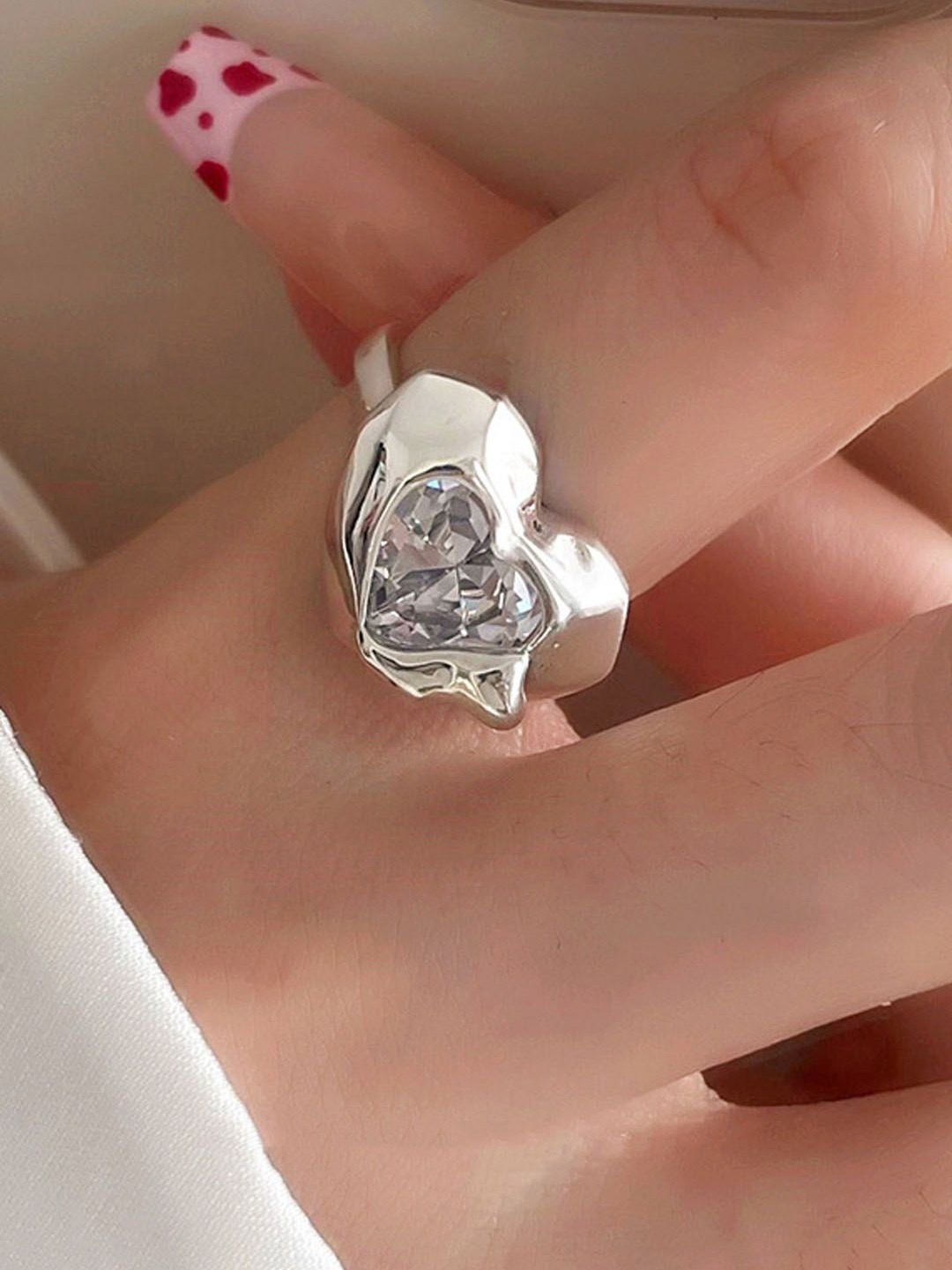 

StyleCast Elegant Silver-Plated Artificial Stones Studded Heart Shaped Finger Ring