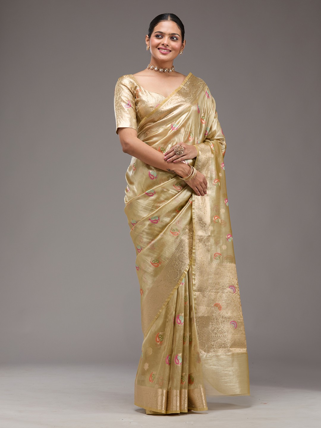 

Koskii Woven Design Gold Embellished Tissue Saree
