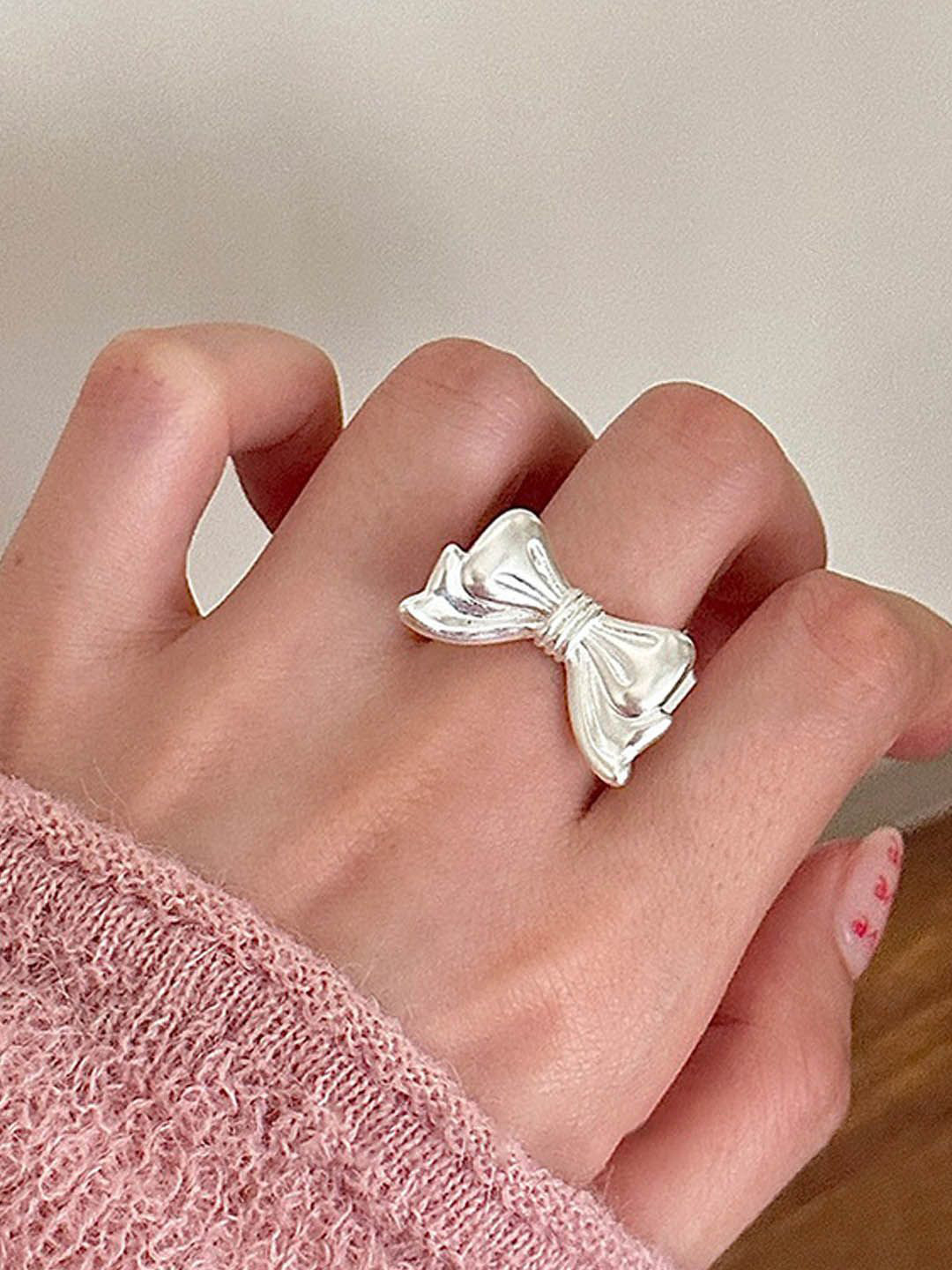 

StyleCast Elegant Silver Toned Intricate Textured Bow Shaped Finger Ring