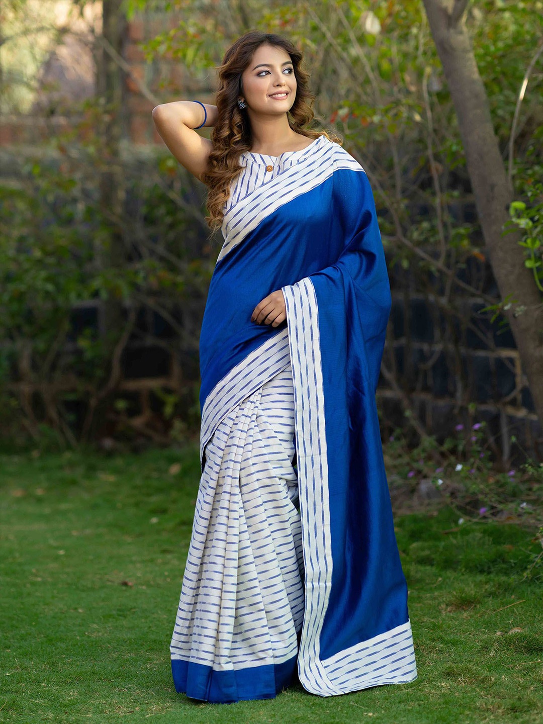 

Prasam Woven Design Silk Cotton Ikat Saree, Blue