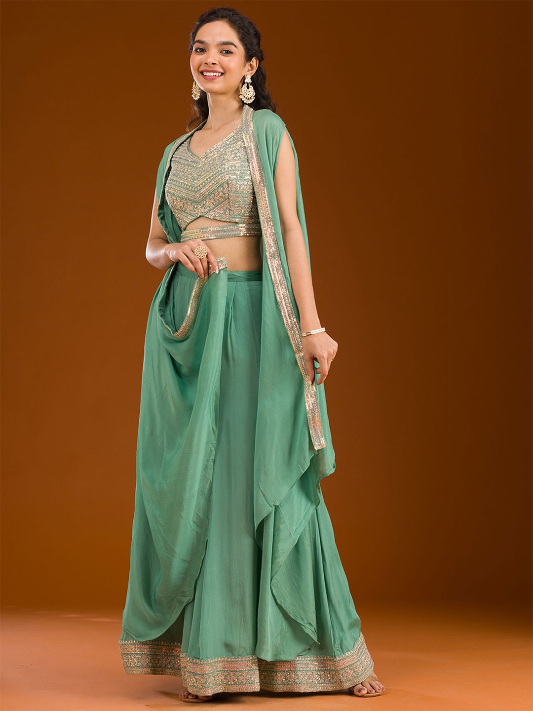 

Koskii Sea Green Zariwork Semi Crepe Readymade Crop Top With Palazzos & Cape Co-Ords