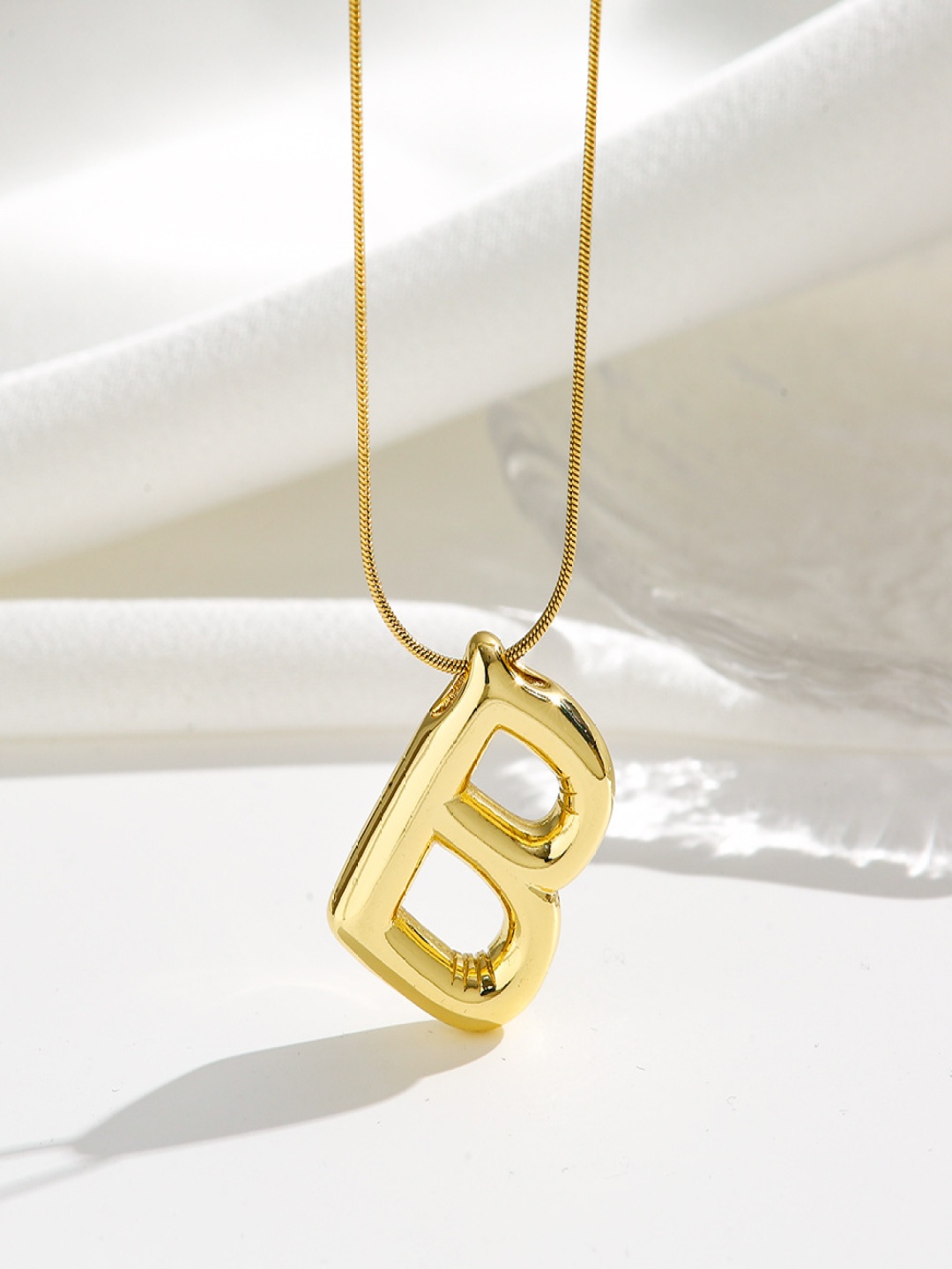 

DressBerry Gold-Plated Contemporary Shaped Pendants With Chains