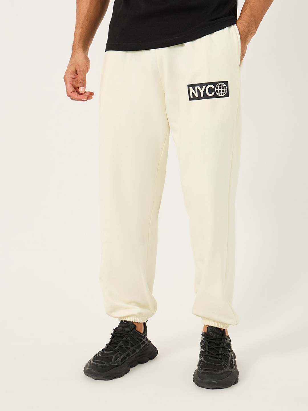 

Styli Men Relaxed Fit Graphic Printed Jogger, Cream