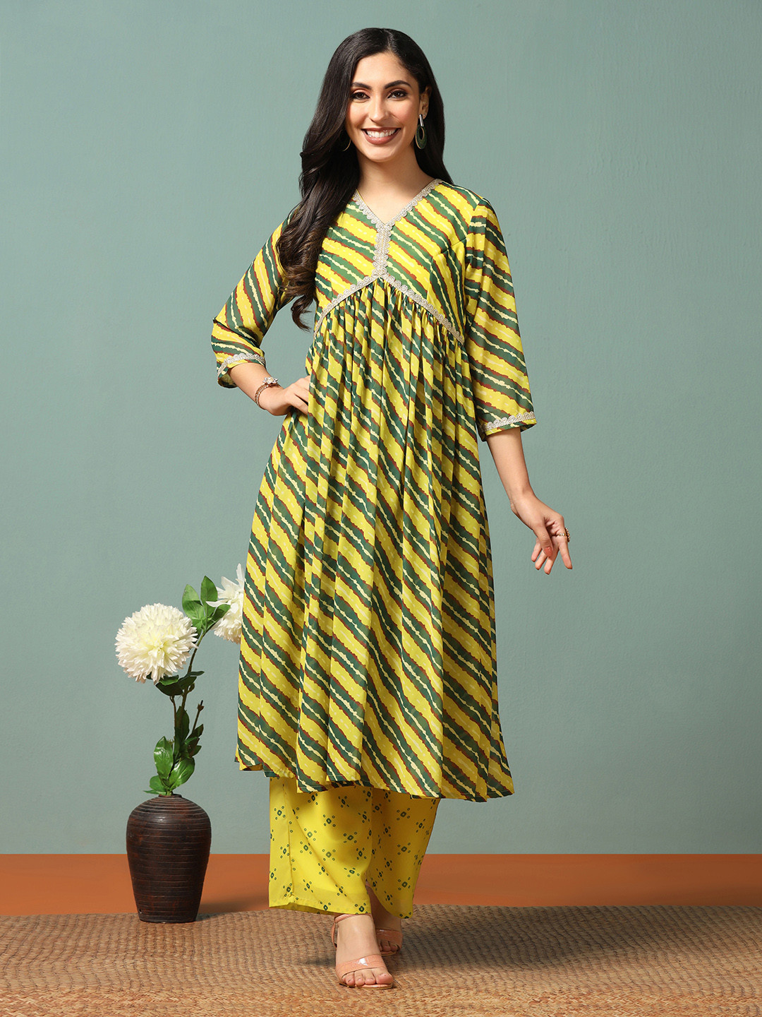

Moda Rapido Leheriya Printed V-Neck Empire Georgette A-Line Kurta With Palazzos, Yellow