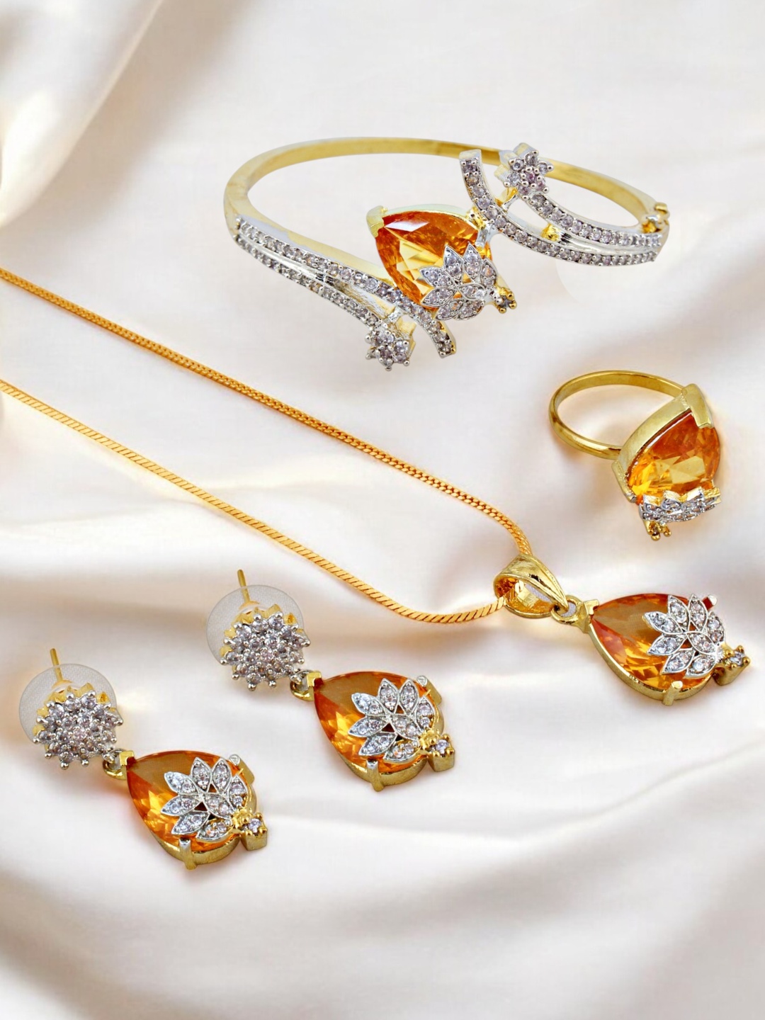 

LUCKY JEWELLERY Gold Plated AD Stone Studded Necklace With Earrings, Ring & Bracelet