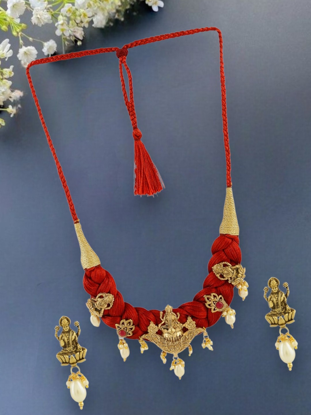 

Anouk Gold-Plated And Red Pearls Beaded Lakshmi Mata Idol Necklace And Earrings