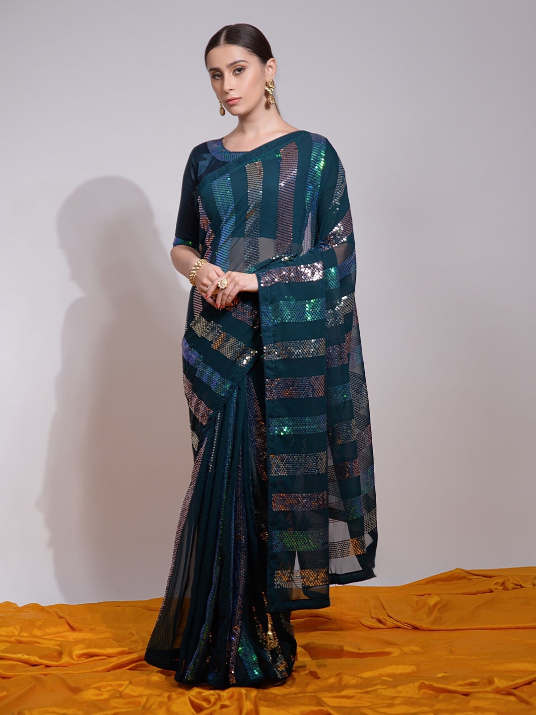 

Moda Rapido Striped Sequinned Pure Georgette Saree, Navy blue