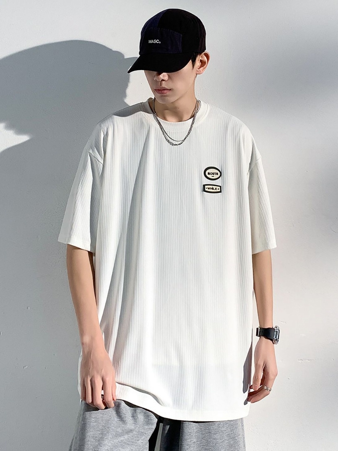 

StyleCast x Revolte Men Solid Round Neck Oversized T-shirt, White