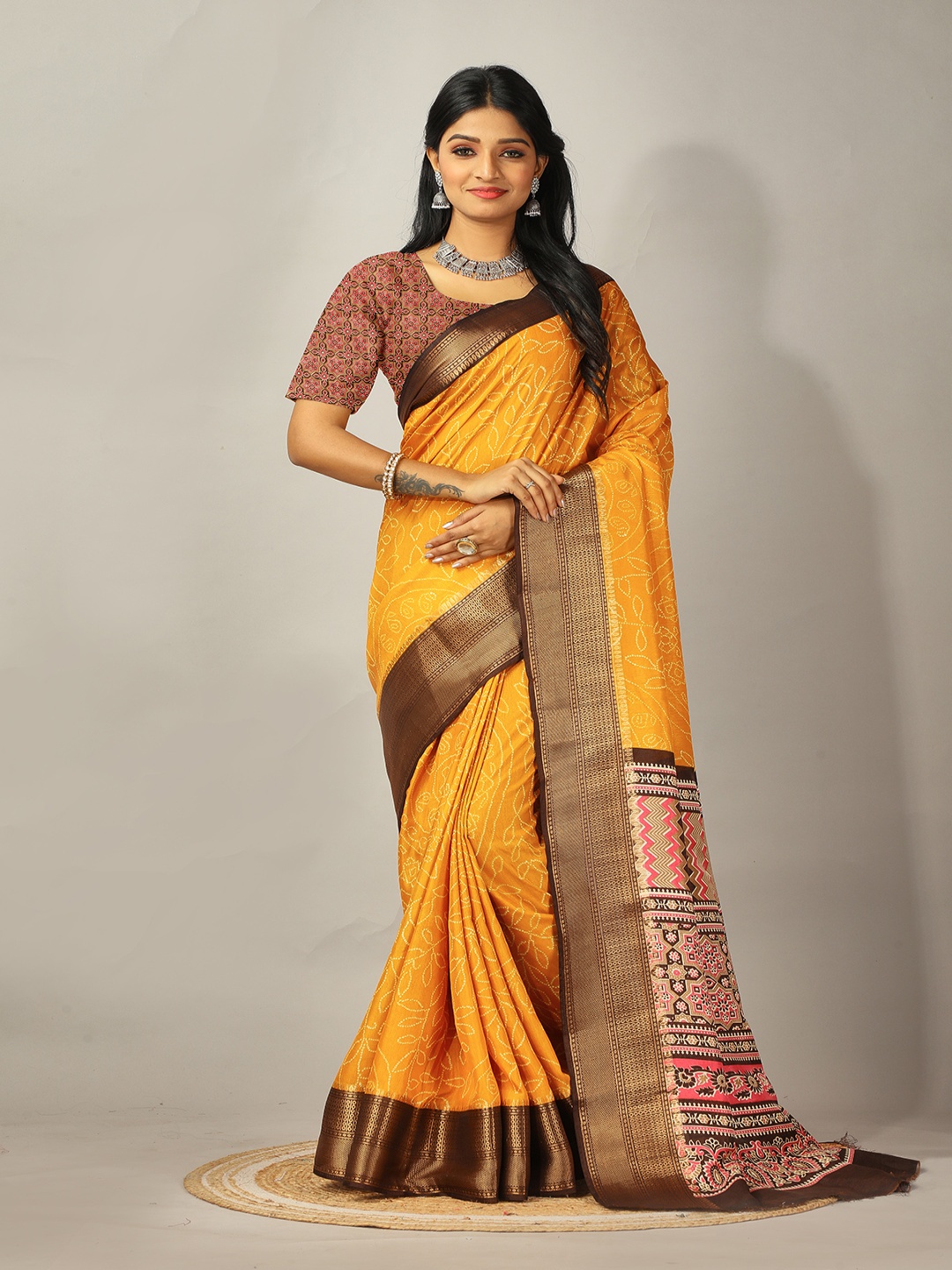 

NIRMAL CREATION Bandhani Printed Zari Pure Crepe Saree, Yellow