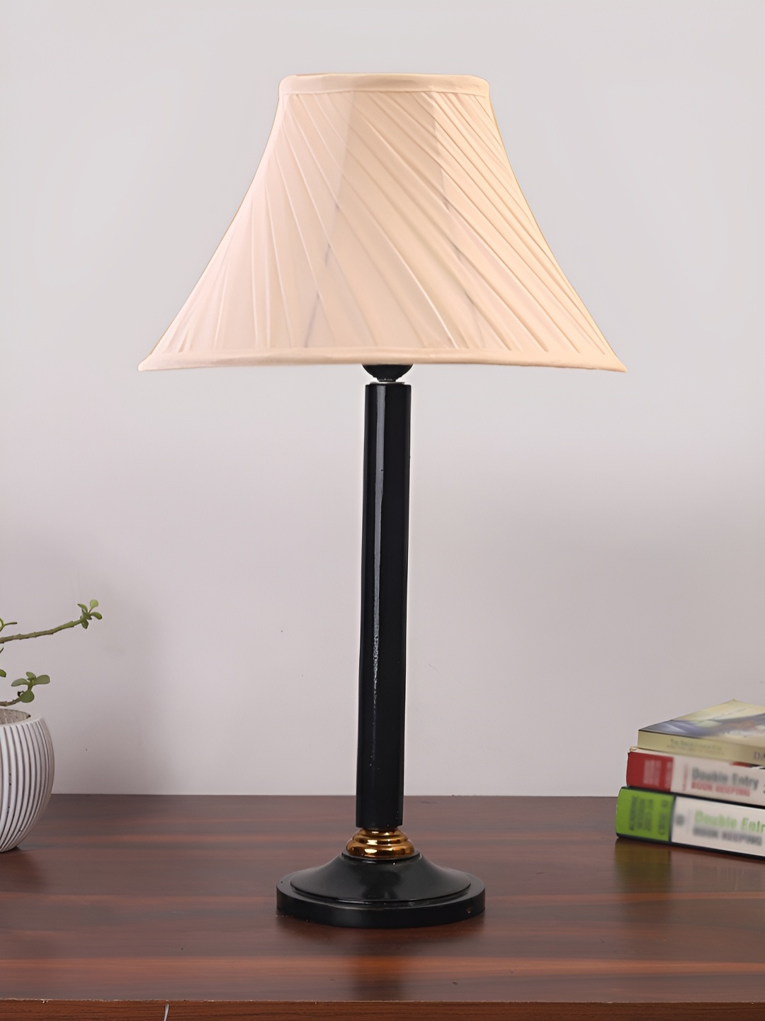 

Devansh Off White and Black Textured Wooden Frusturical Shaped Table Lamp