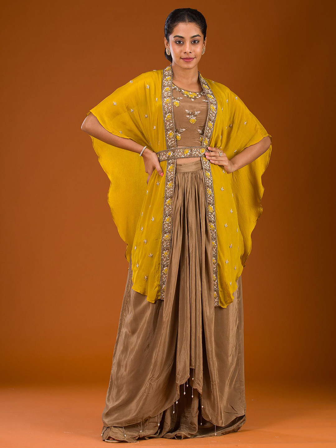 

Koskii Brown Cutdana Georgette Readymade Crop Top With Skirt & Cape Co-Ords