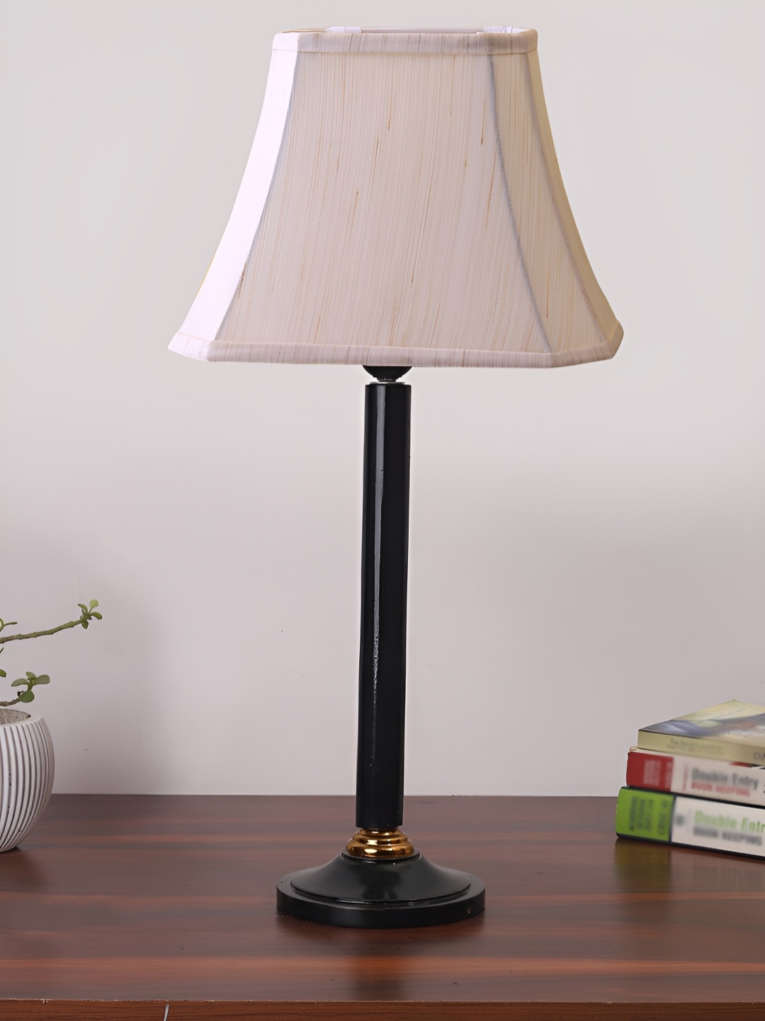 

Devansh Off White & Black Frustum Shaped Cotton Table Lamp