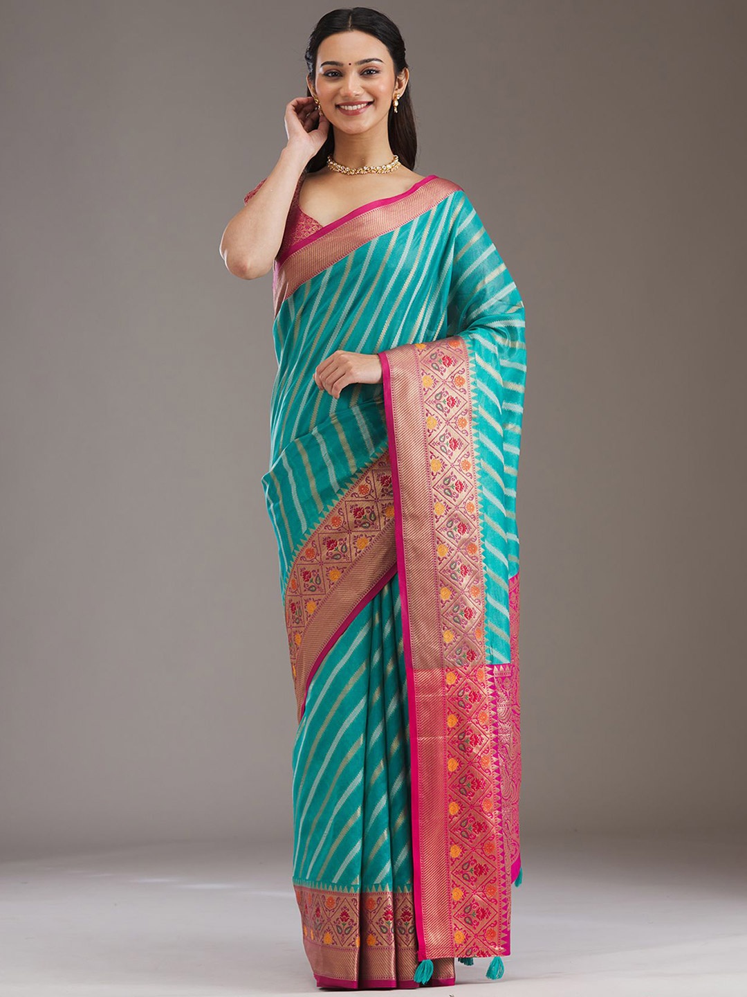 

Koskii Turquoise Blue Zariwork Tissue Saree