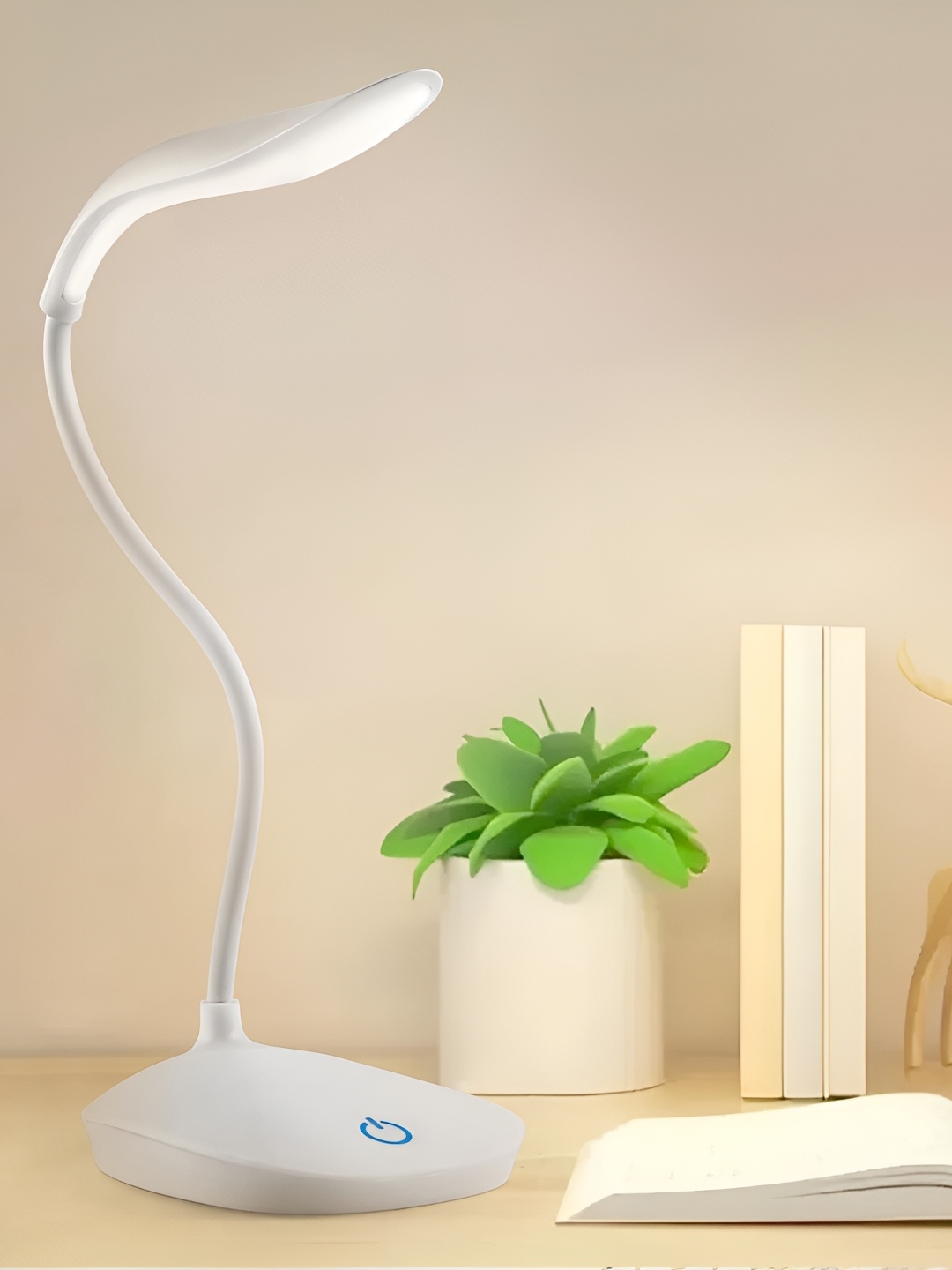 

Myntra Elegant Homes White Abstract Shaped Table Lamp With Bulb