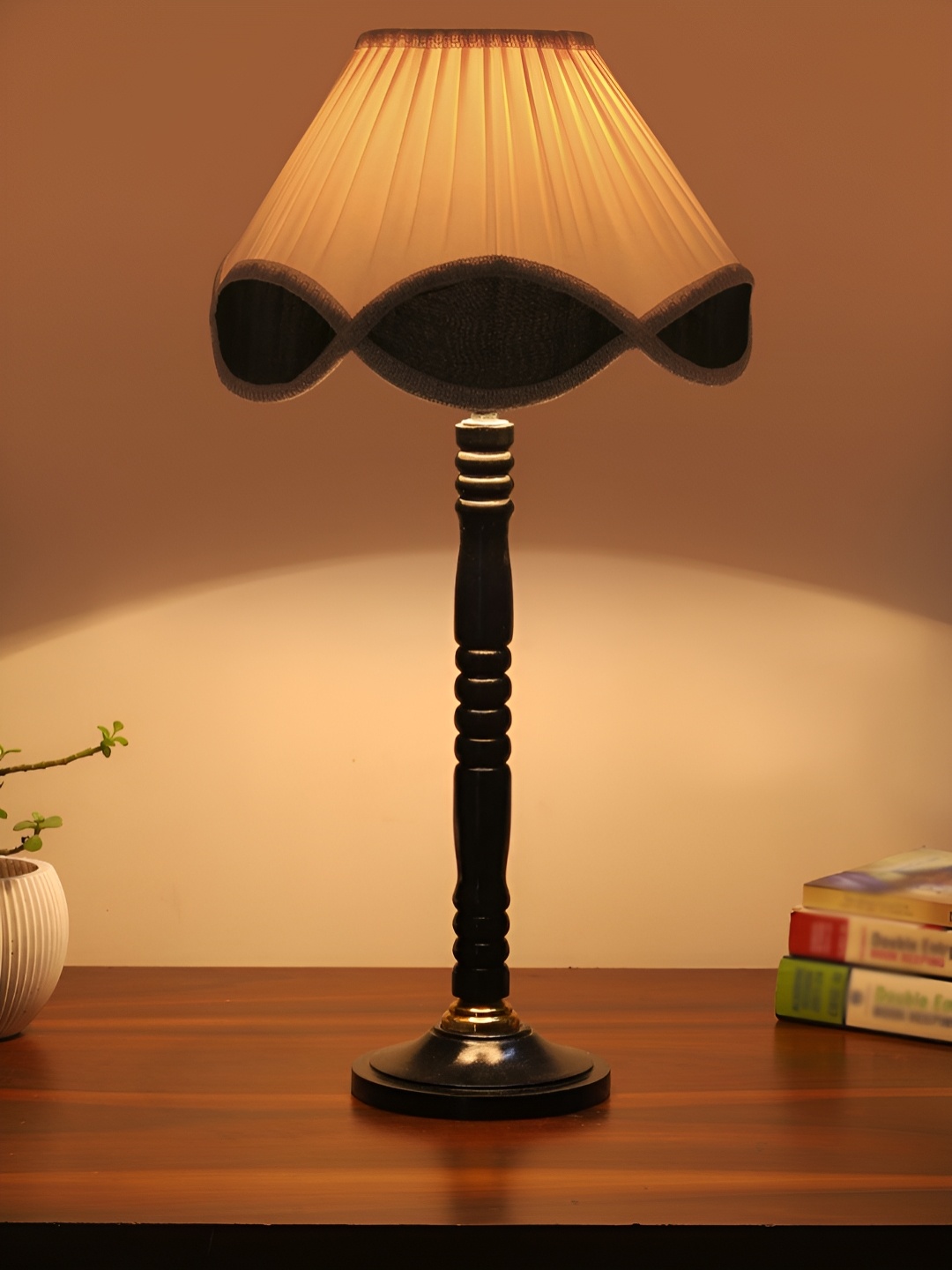 

Devansh Off White and Black Textured Wooden Frusturical Shaped Table Lamp