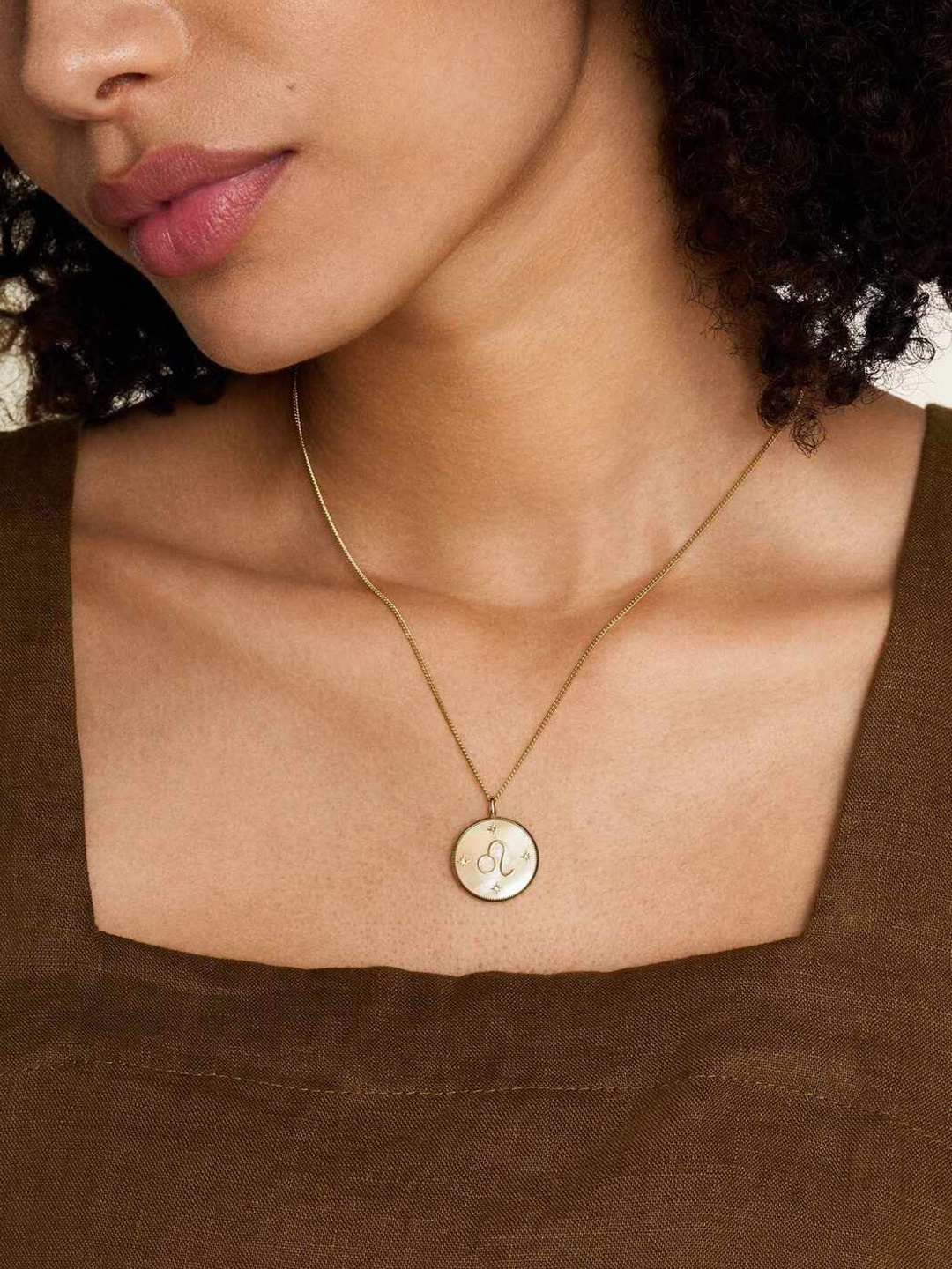 

Fossil Gold-Toned Stainless Steel Circular Shaped Pendants with Chains