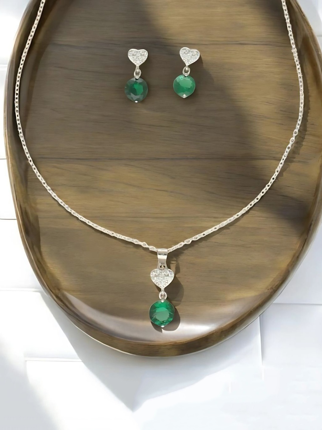 

Sri Jagdamba Pearls Dealer 925 Silver Plated CZ Stone Studded Jewellery Set