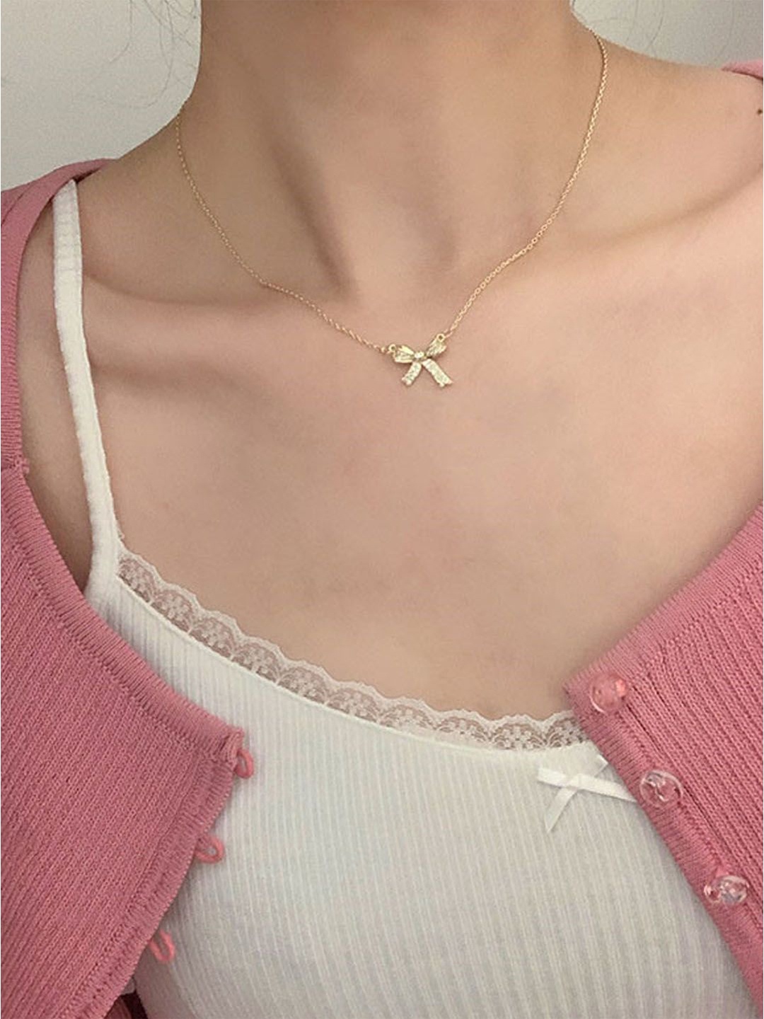 

StyleCast Gold-Toned Stone Studded Bow Shaped Elegant Pendant With Chain