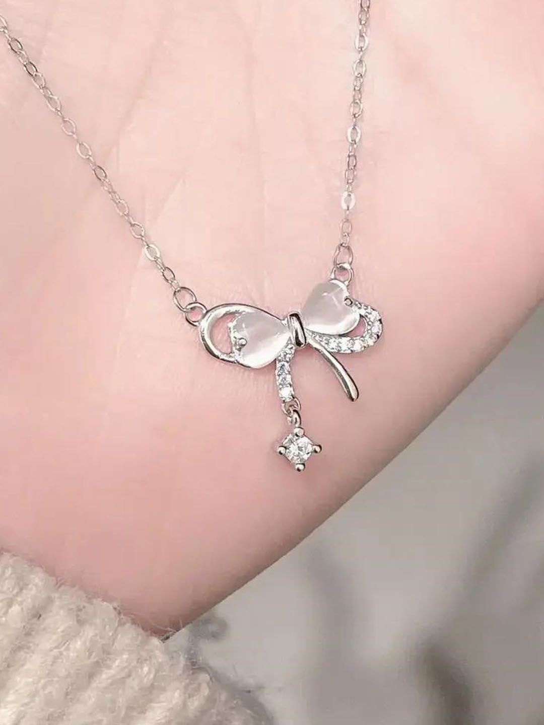 

StyleCast Elegant Silver-Toned Stone Studded Bow Knot Shaped Chain