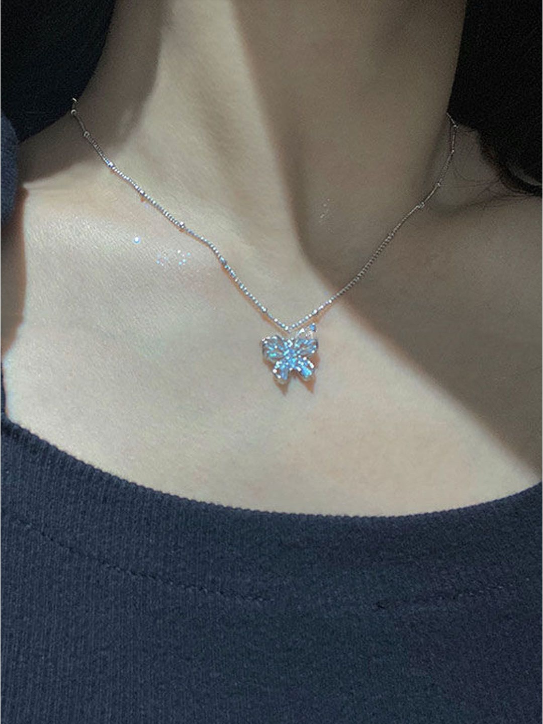 

StyleCast Elegant Silver-Toned Stones-Studded Butterfly Shaped Pendant With Chain
