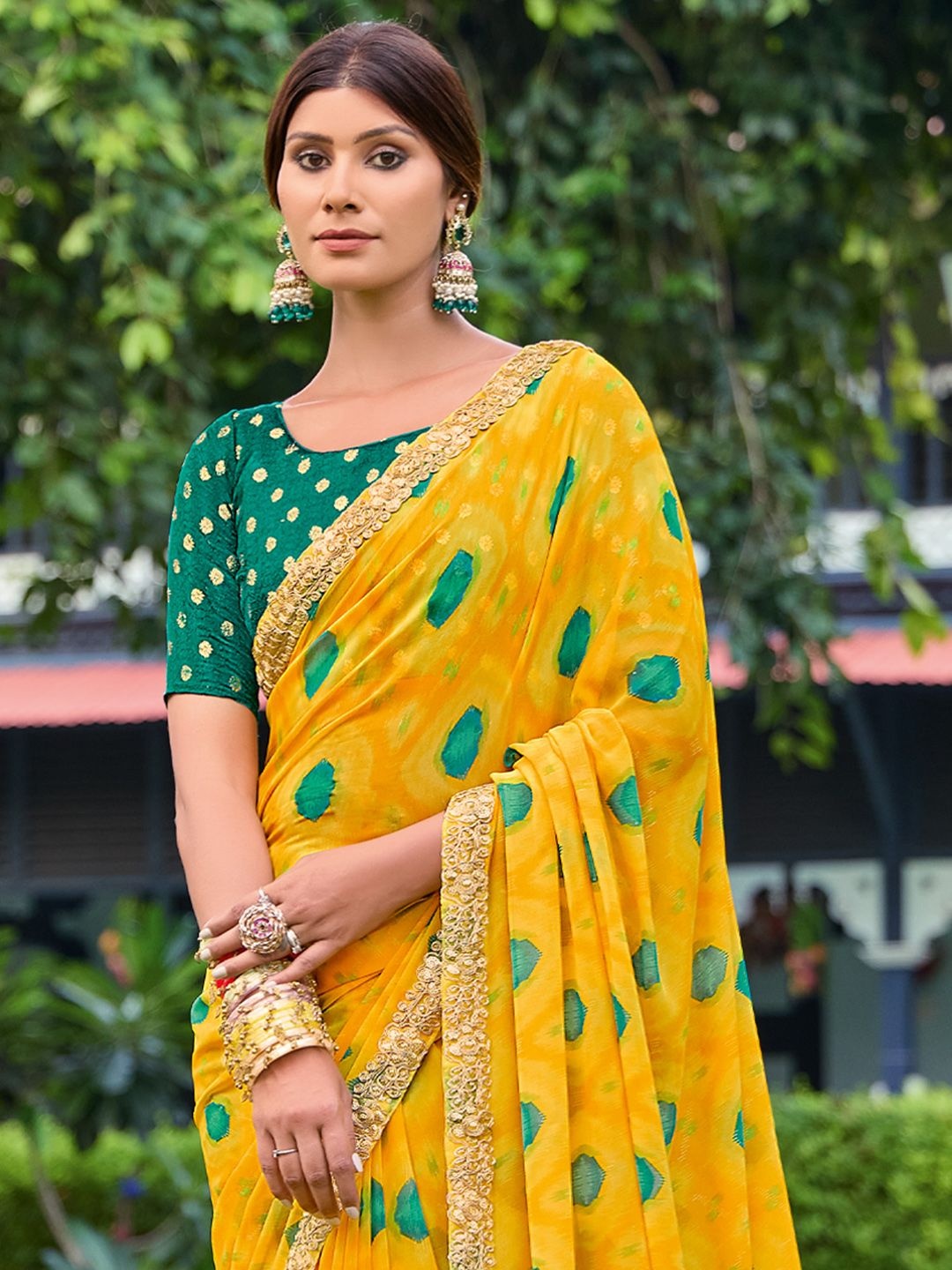 

Saree mall Ethnic Motifs Embroidered Poly Georgette Sarees, Yellow
