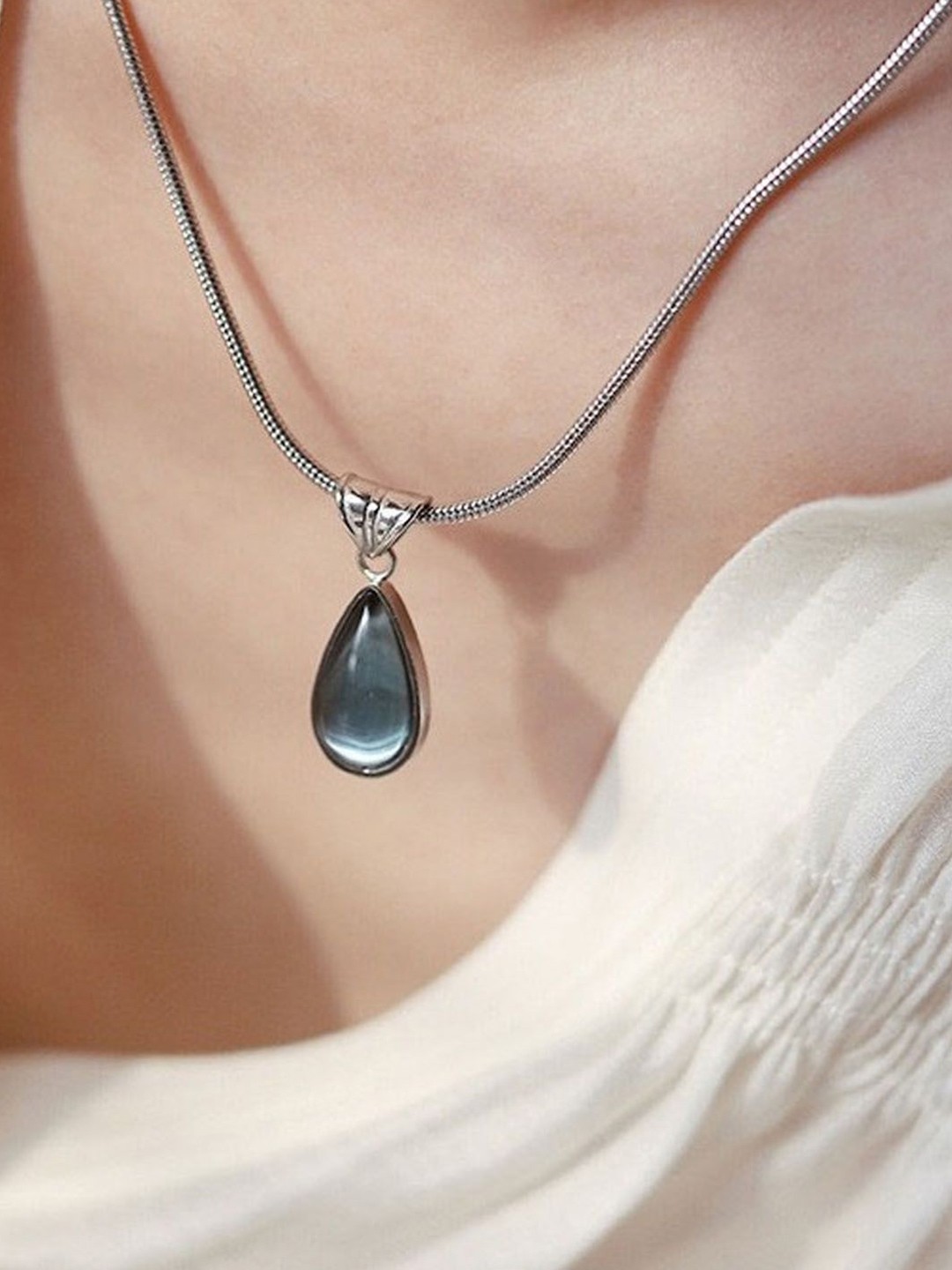 

StyleCast Silver-Toned Stone Studded Elegant Pendant With Chain