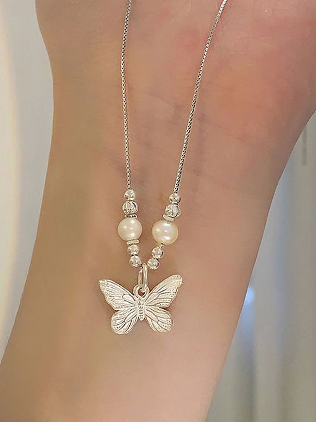 

StyleCast Elegant Silver-Toned Pearls Beaded Butterfly Shaped Chain