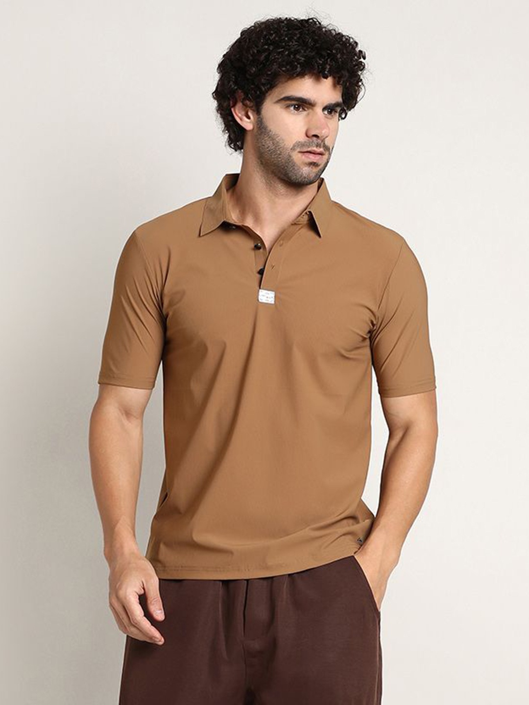 

Campus Sutra Men Solid Polo Collar T-shirt, Brown