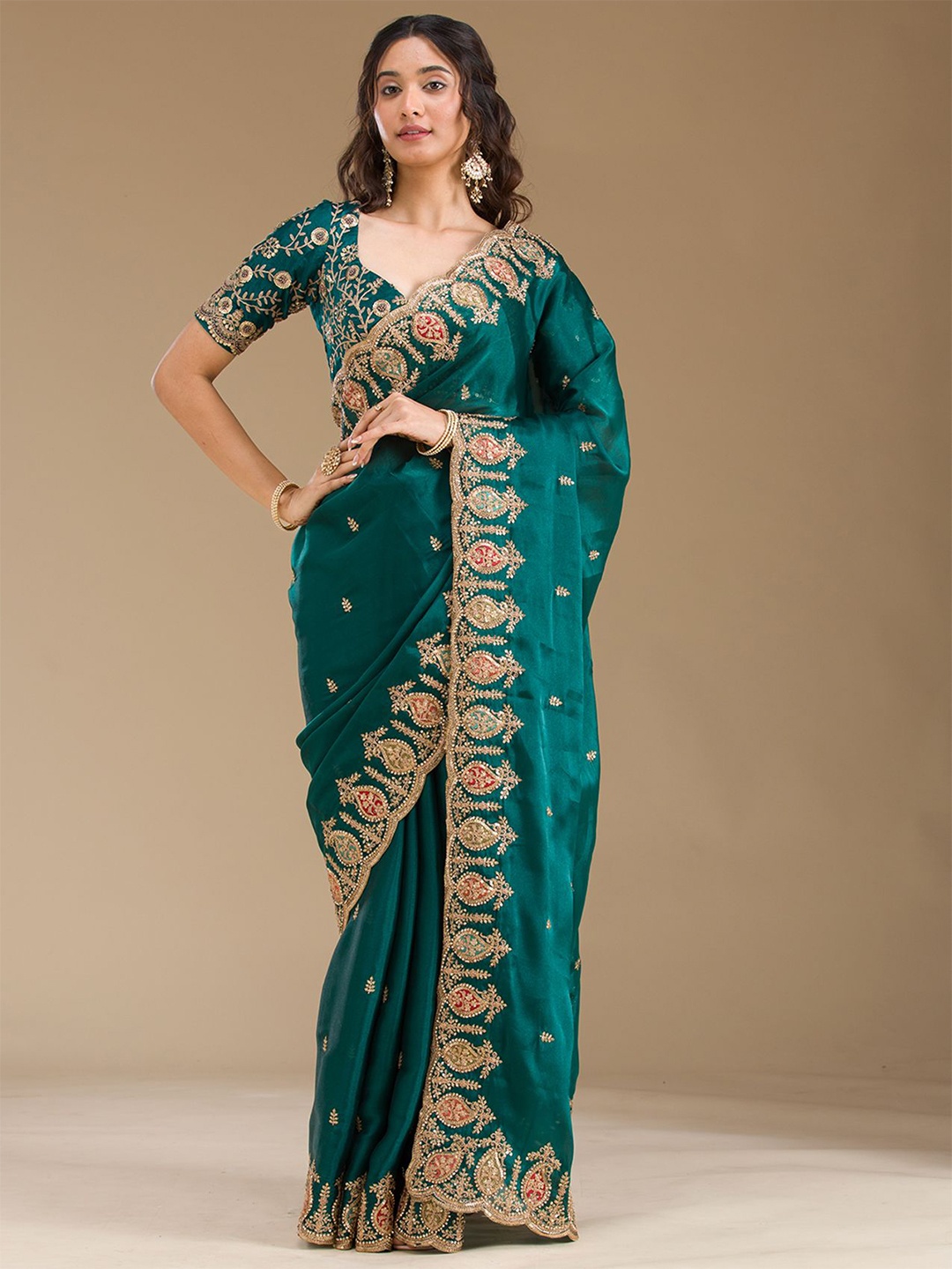 

Koskii Ethnic Motifs Sequinned Peacock Green Zariwork Tissue Saree