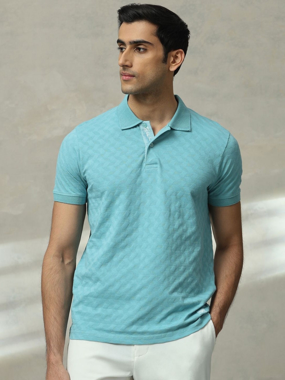 

Mufti Men Self Design Polo Collar Cotton Slim Fit T-shirt, Turquoise blue