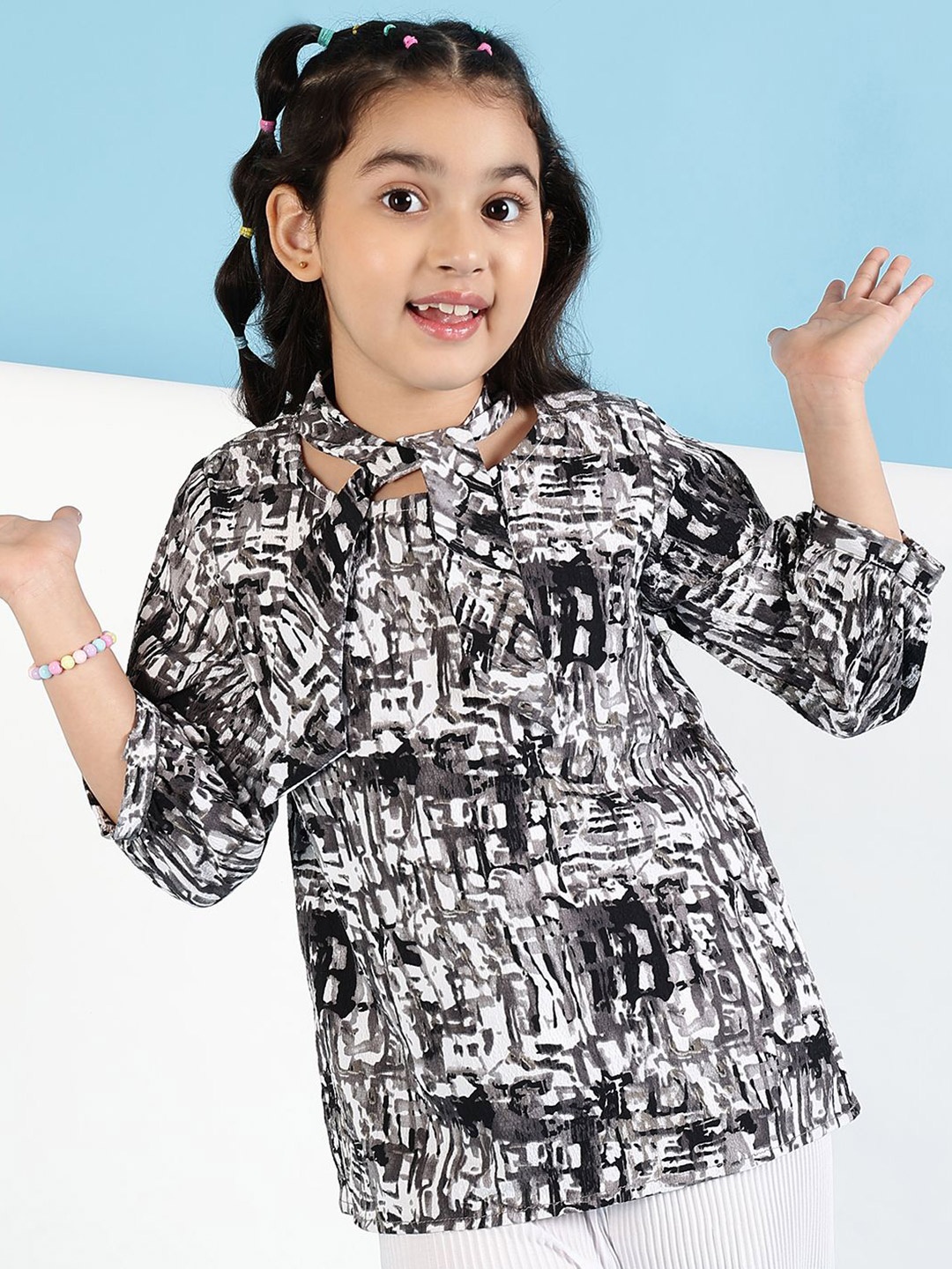 

Ishti Girls Printed Tie-Up Neck Puff Sleeves Top, Black