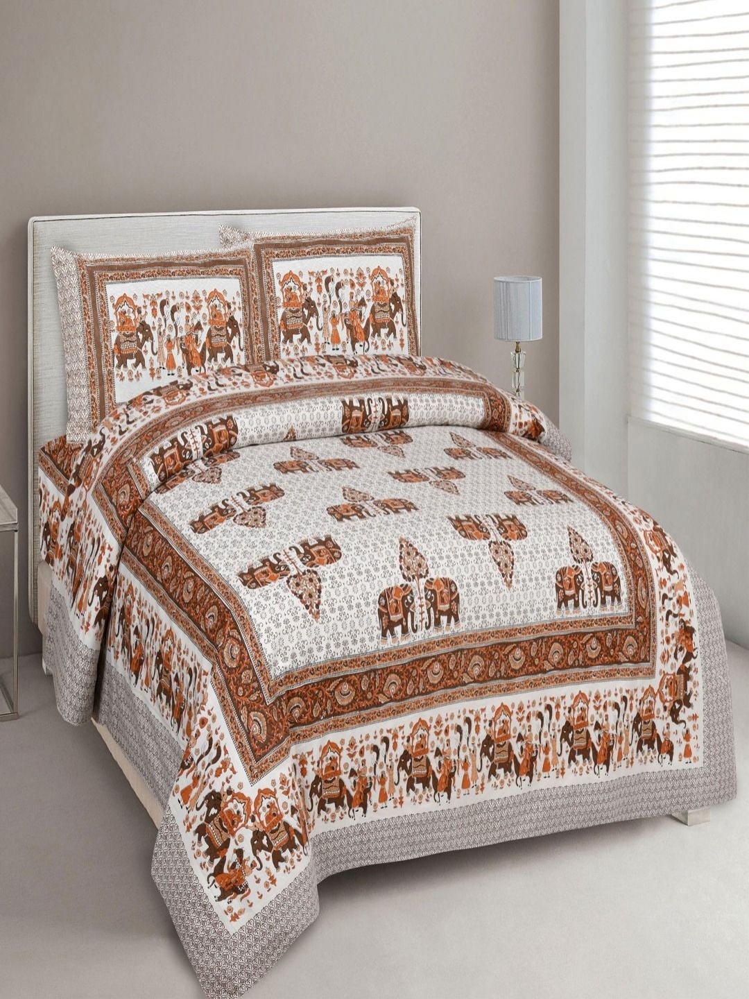 

Myntra Elegant Homes Orange & White Printed Cotton 180 TC King Bedsheet Set 2.74m x 2.54m