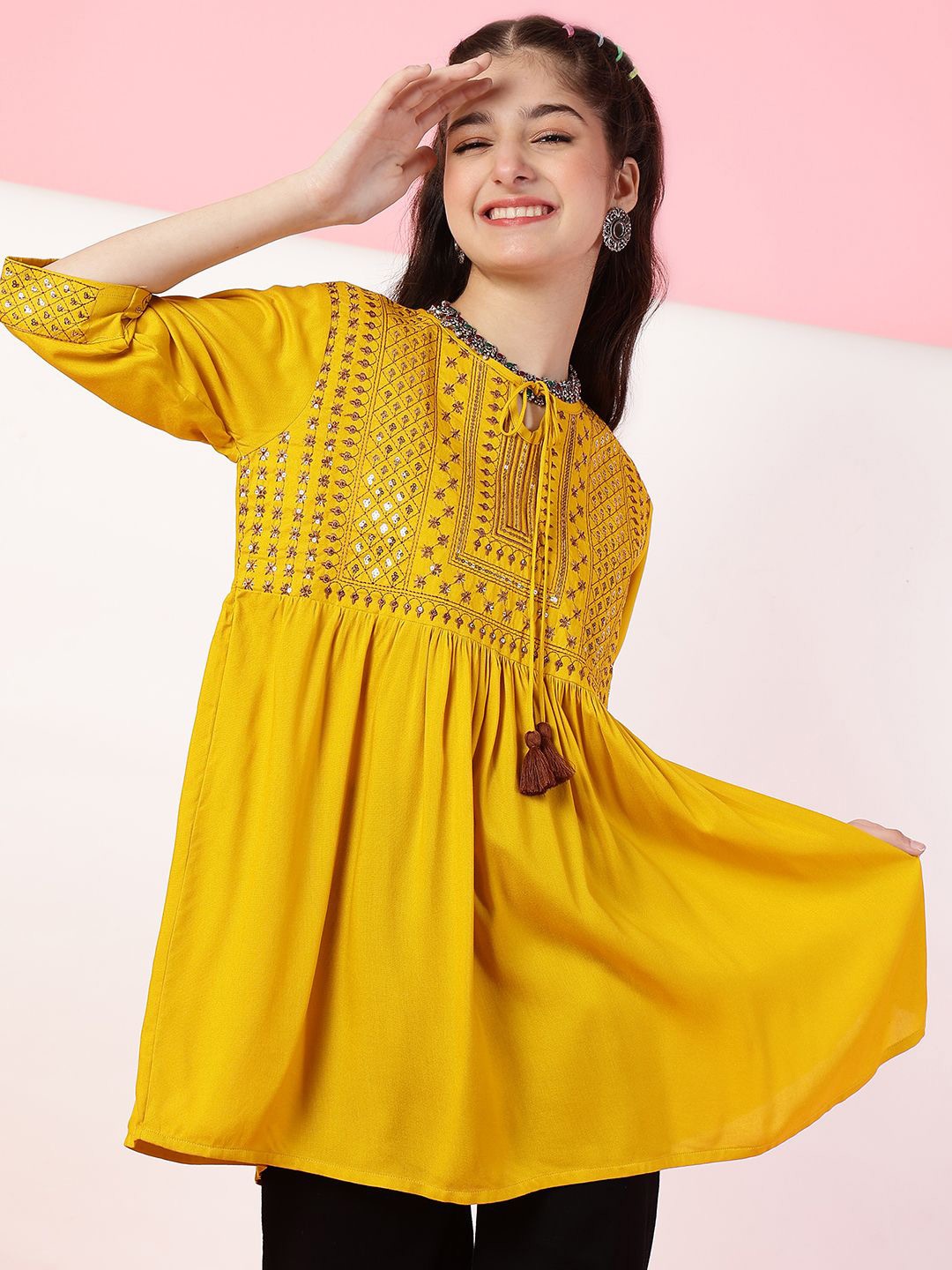 

Ishti Girls Embroidered A-line Top, Mustard