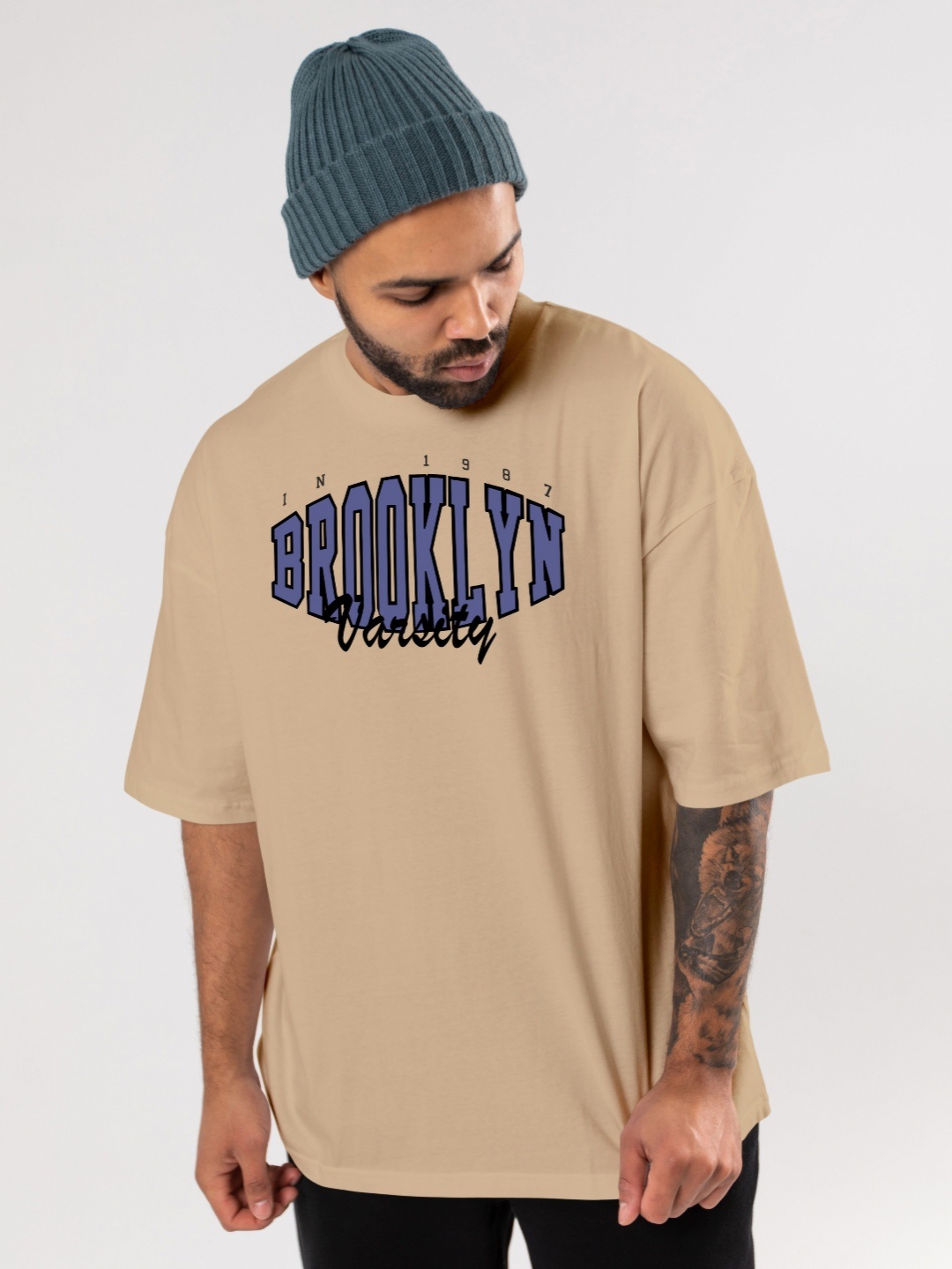 

FLYIND VOGUE OUTFIT Men Bio Finish Typography Printed Round Neck Cotton Oversized T-shirt, Beige