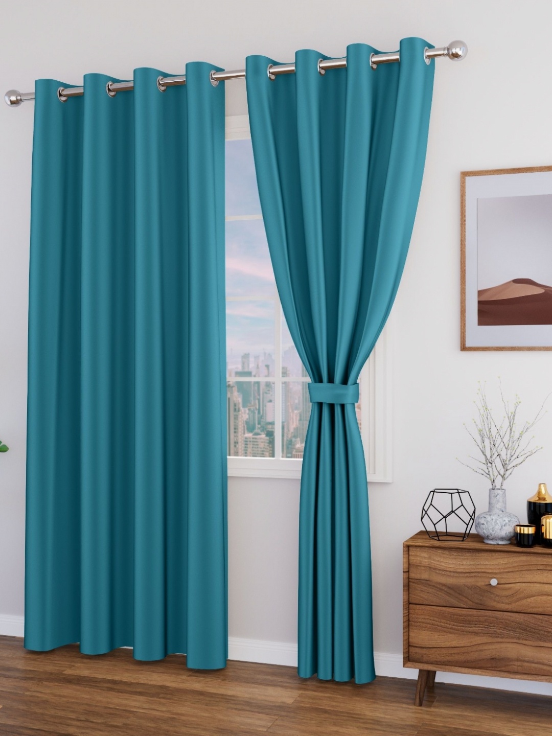 

Myntra Elegant Homes Blue Set of 2 Black Out Window Curtain