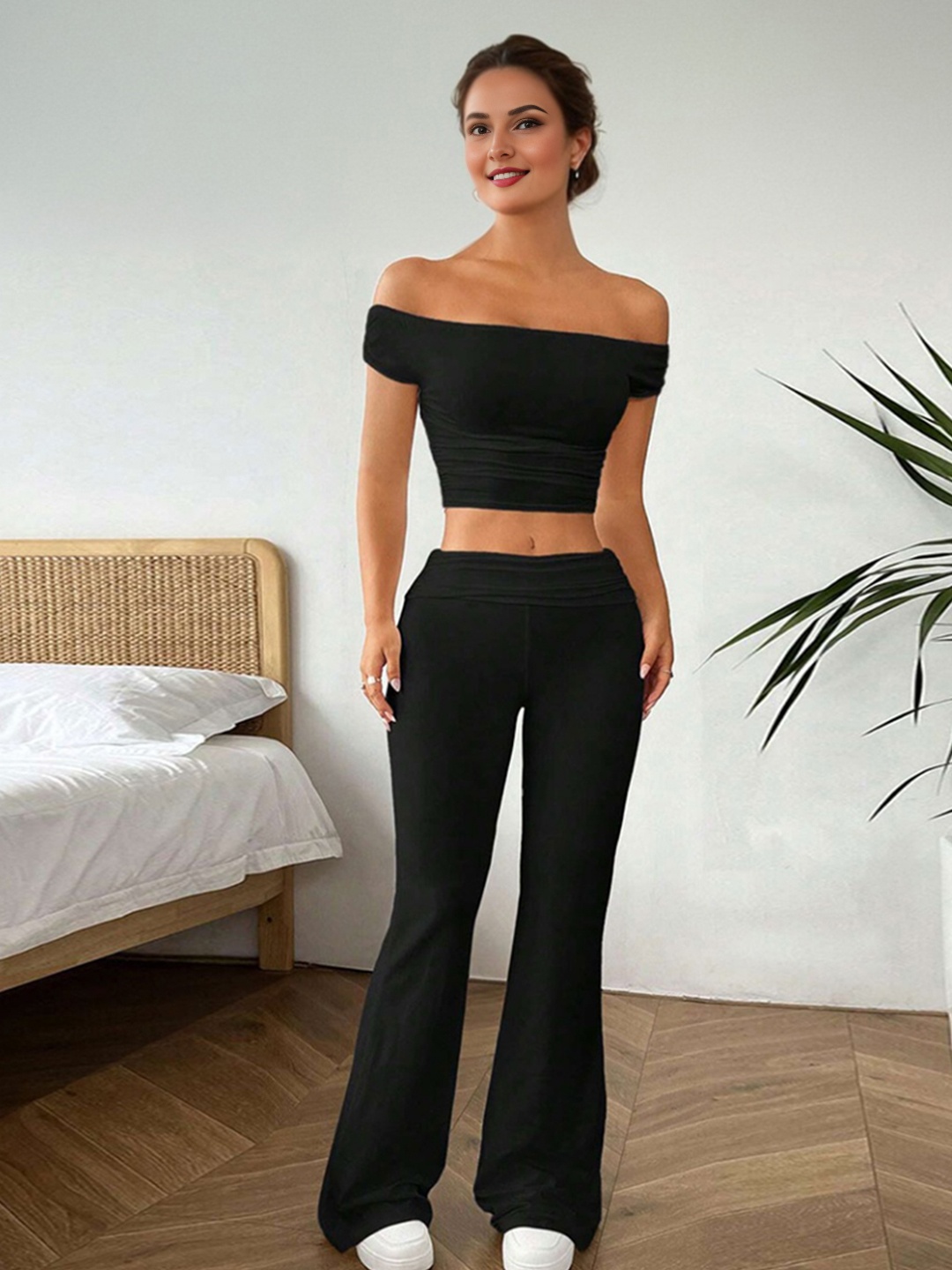 

StyleCast Black Off Shoulder Sleeveless Top With Flared Trousers