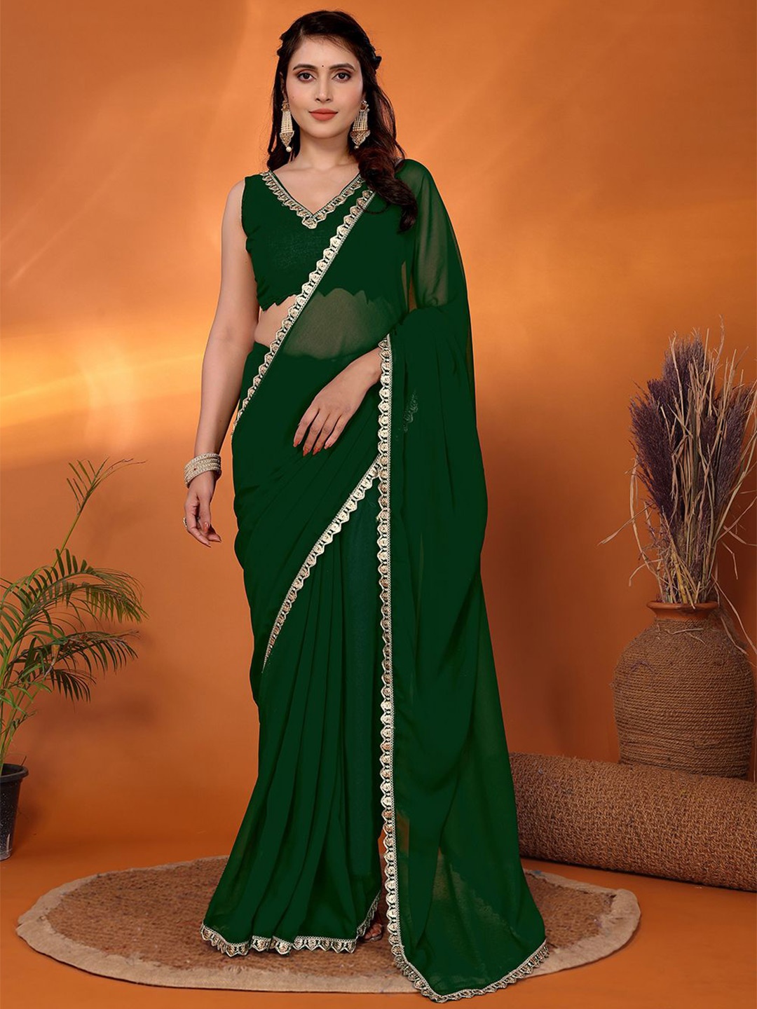

FABMORA Sequinned Pure Georgette Saree, Green