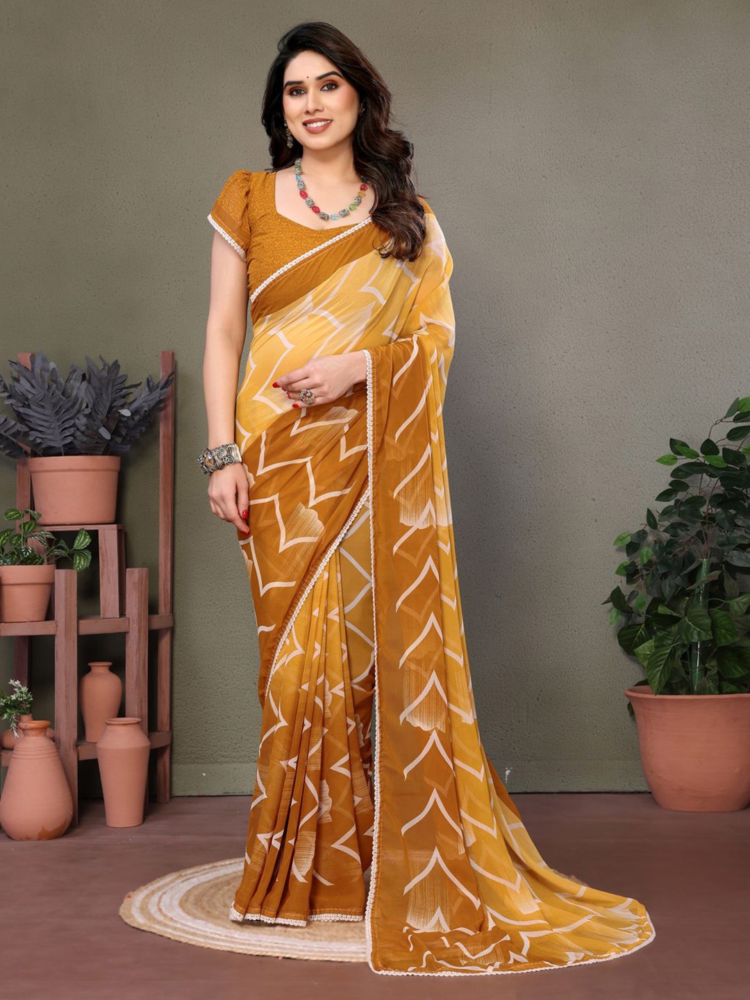 

DIVASTRI Geometric Embroidered Pure Georgette Block Print Saree, Mustard