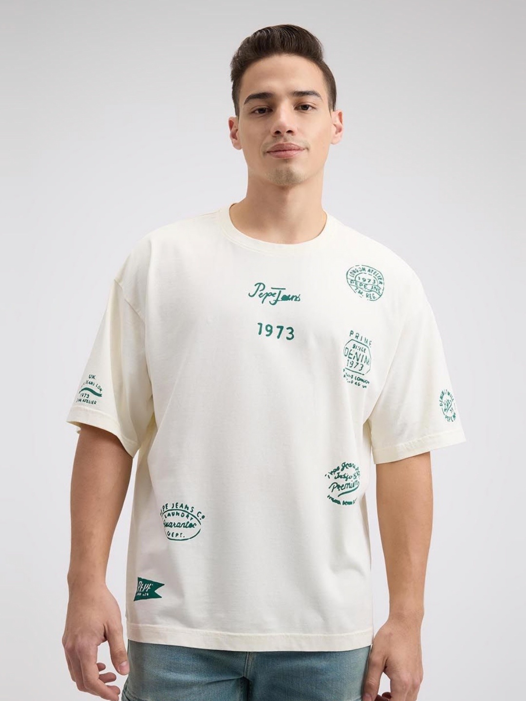 

Pepe Jeans Men Typography Printed Round Neck Cotton Oversized T-shirt, Off white