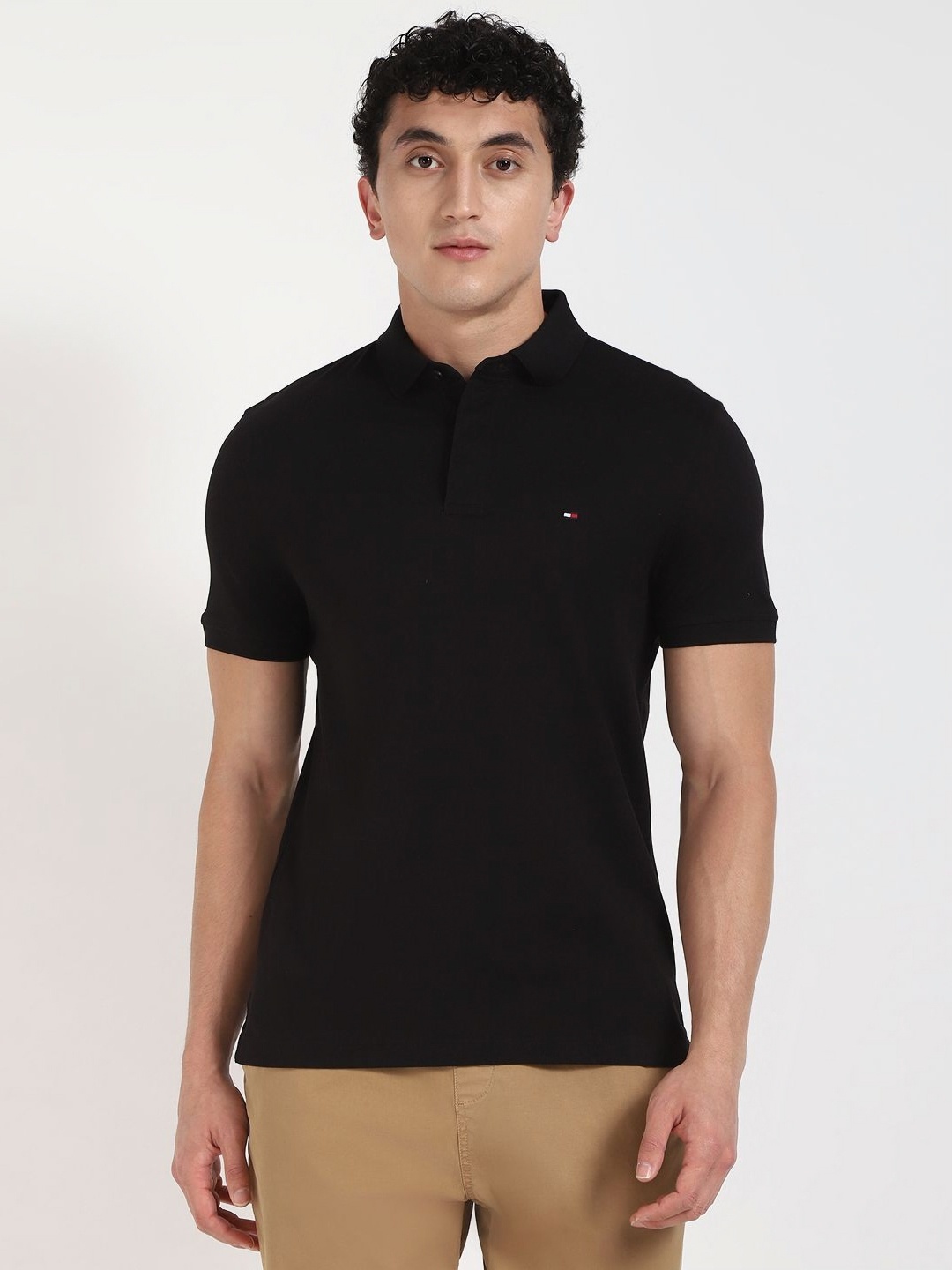 

Tommy Hilfiger Men Solid Polo Collar Cotton T-shirt, Black