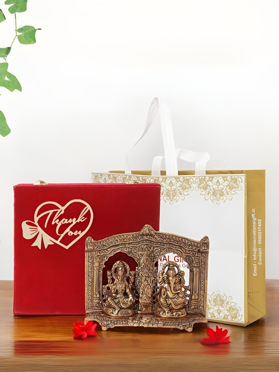 

INTERNATIONAL GIFT Copper-Toned God Laxmi Ganesh Religious Idol Showpiece With Box & Bag