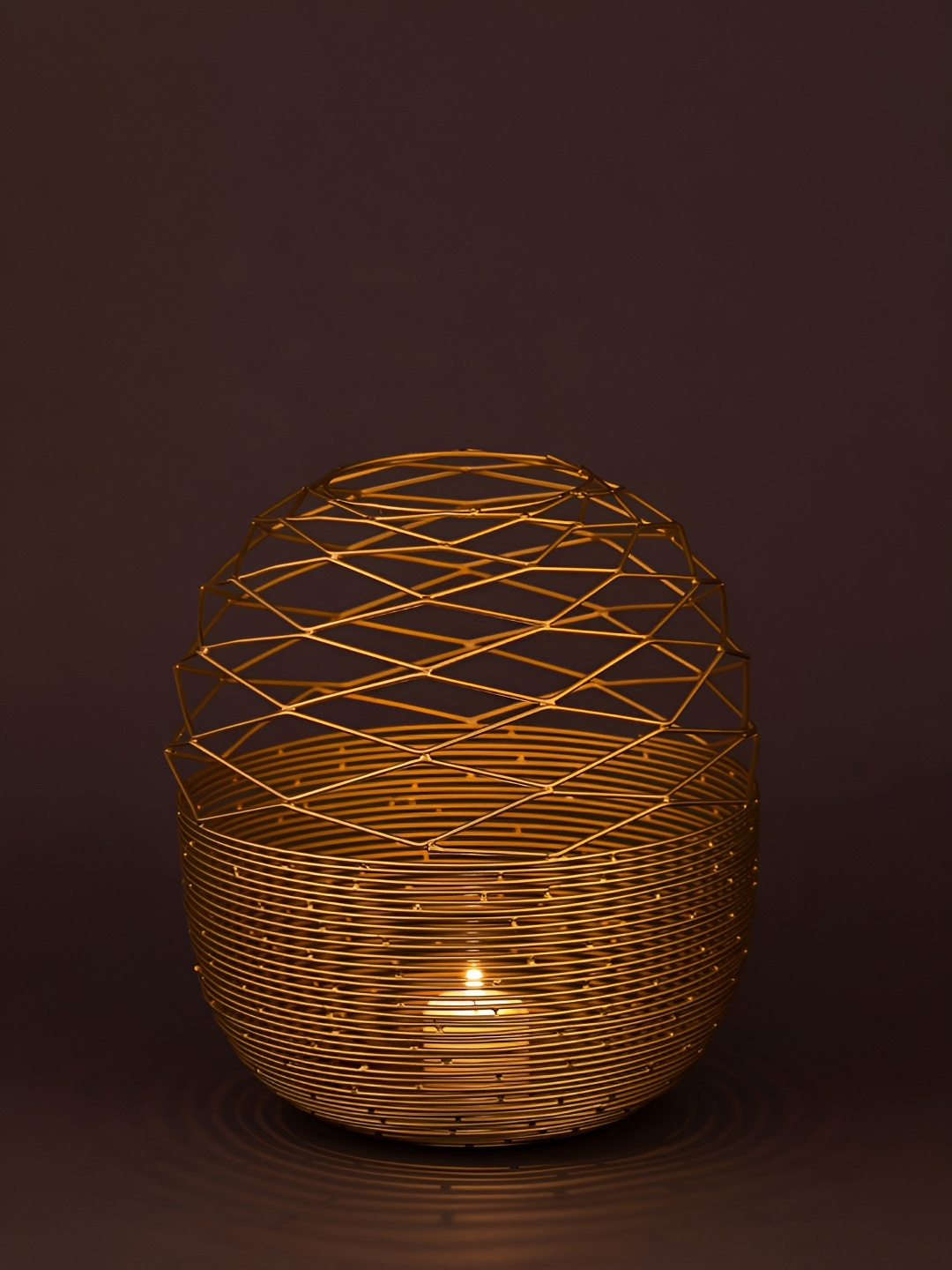 

Myntra Elegant Homes Gold-Toned Textured Iron Candle Holder