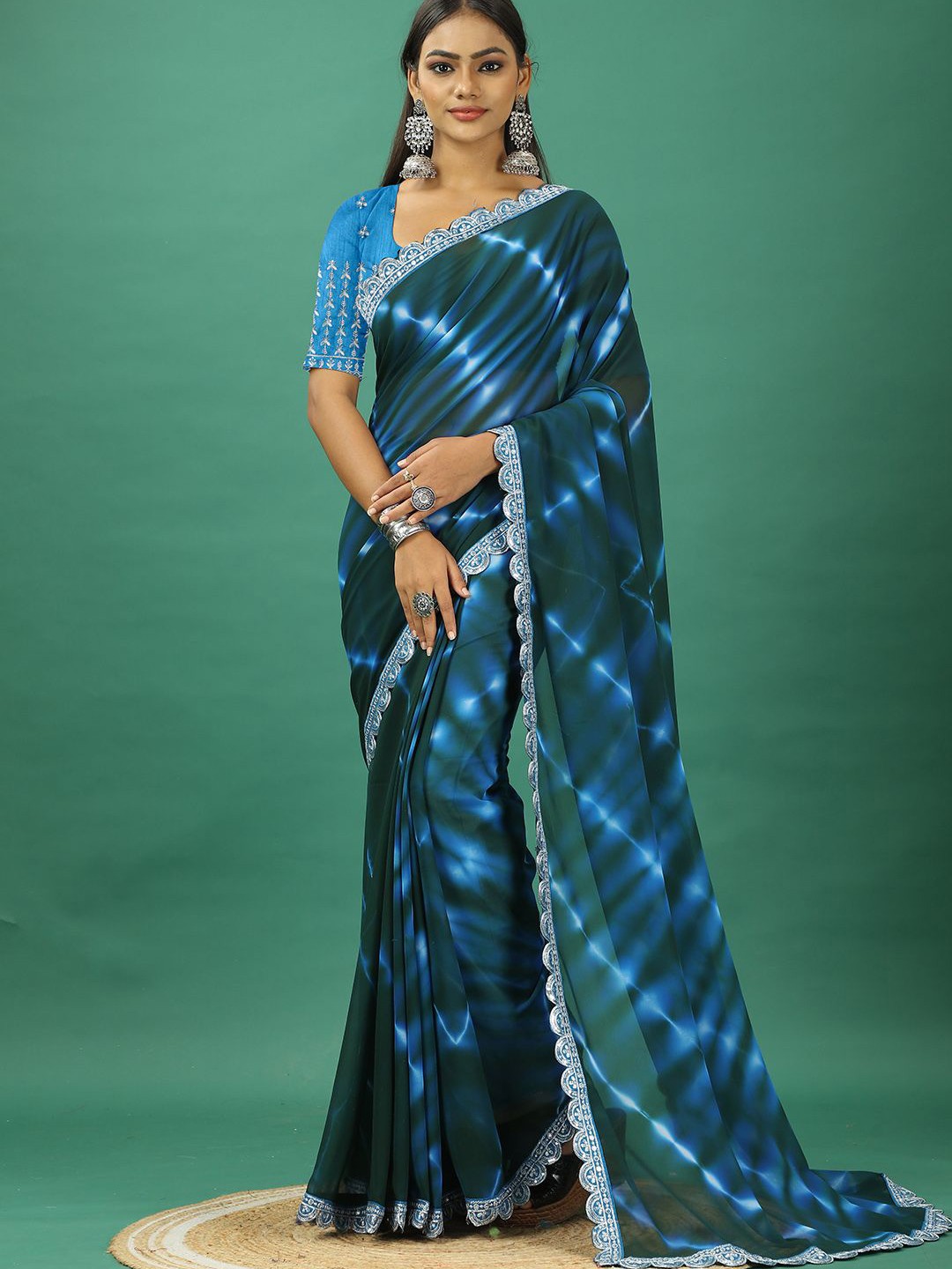 

NIRMAL CREATION Tie and Dye Embroidered Pure Georgette Saree, Turquoise blue