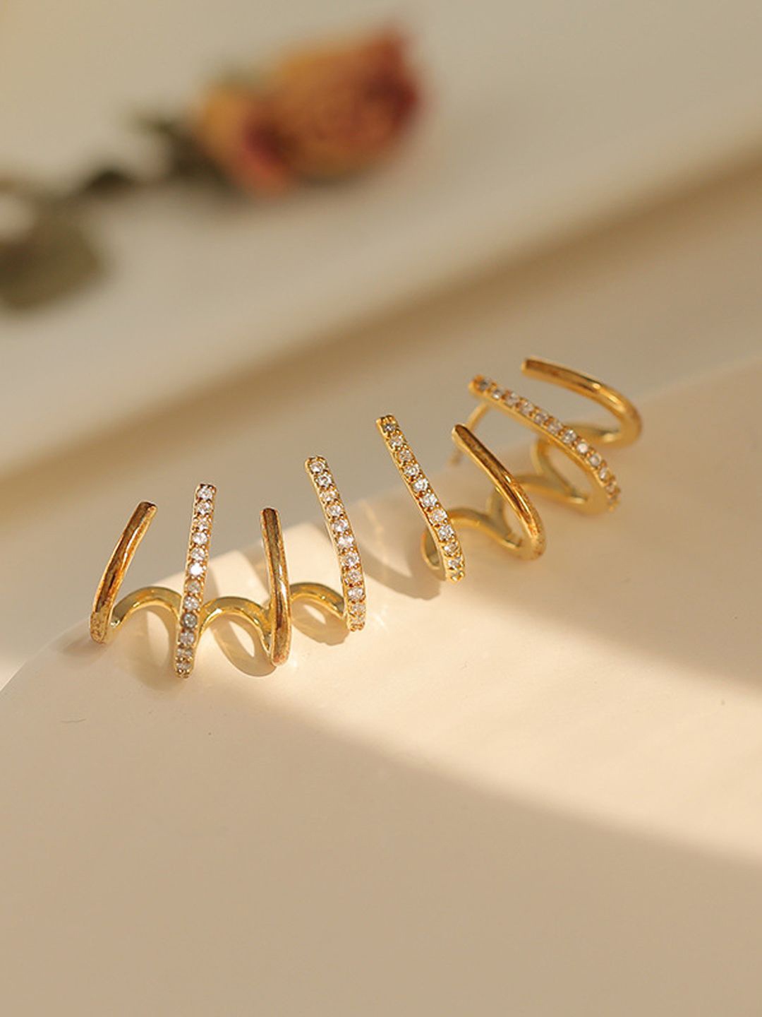 

styledose Stainless Steel Gold-Plated Artificial Stone Studded Contemporary Shaped Studs