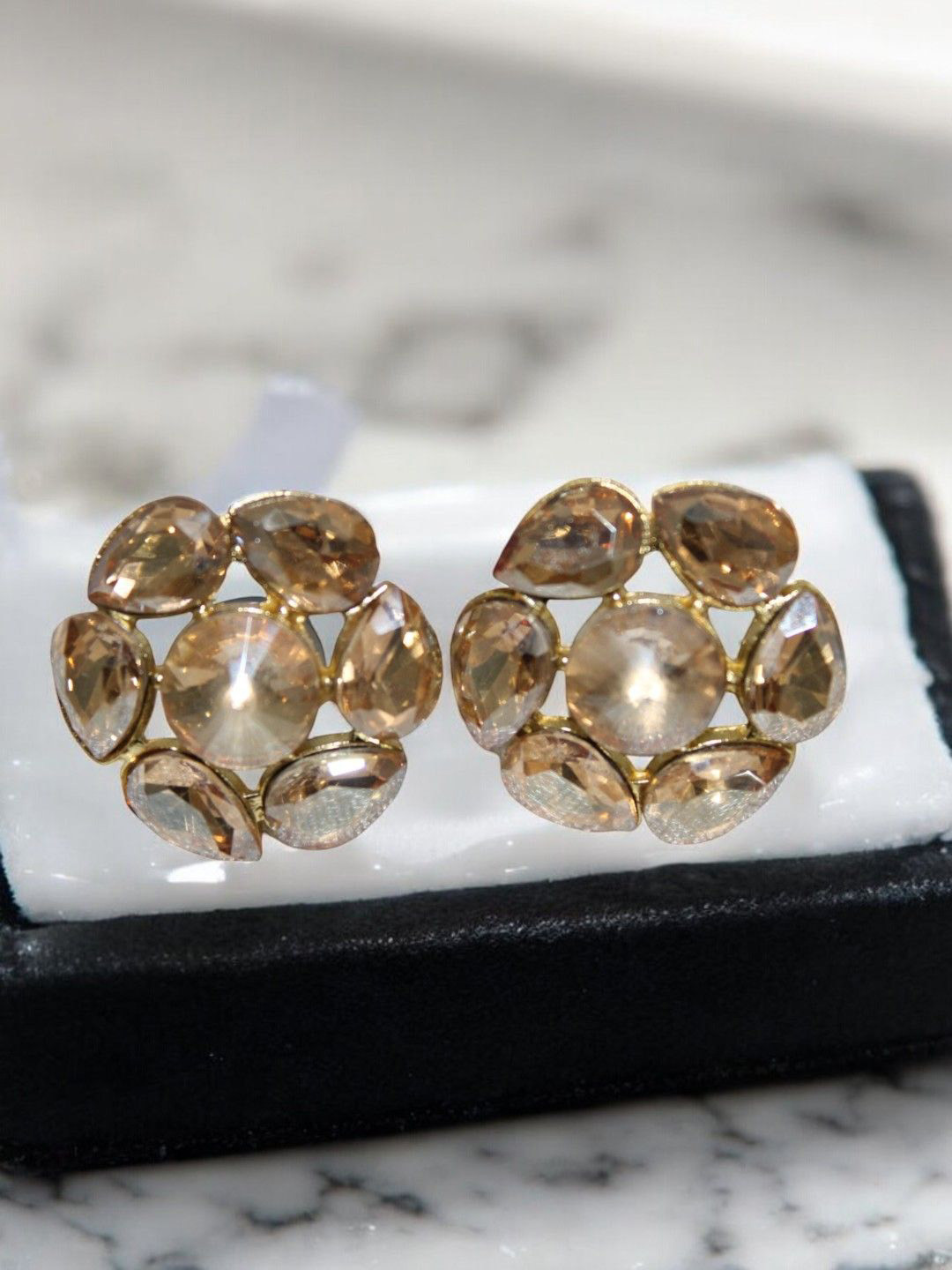 

Jolly Faces Gold-Plated Artificial Stone Studded Floral Shaped Studs