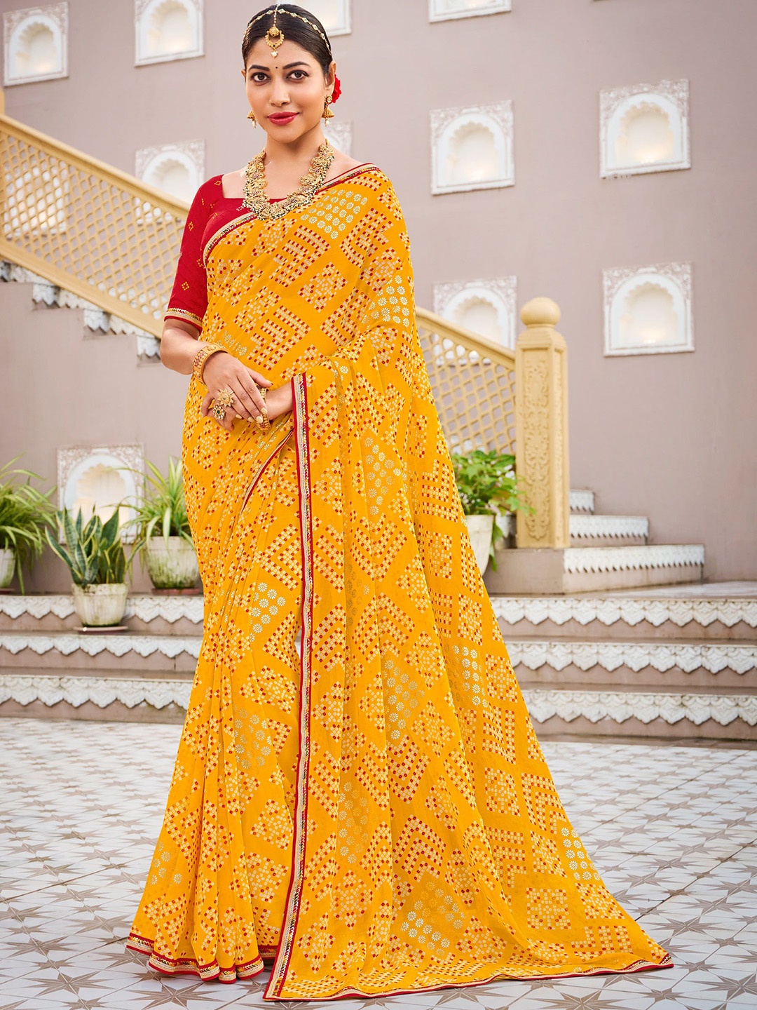 

Laxmipati Bandhani Embroidered Poly Chiffon Saree, Mustard