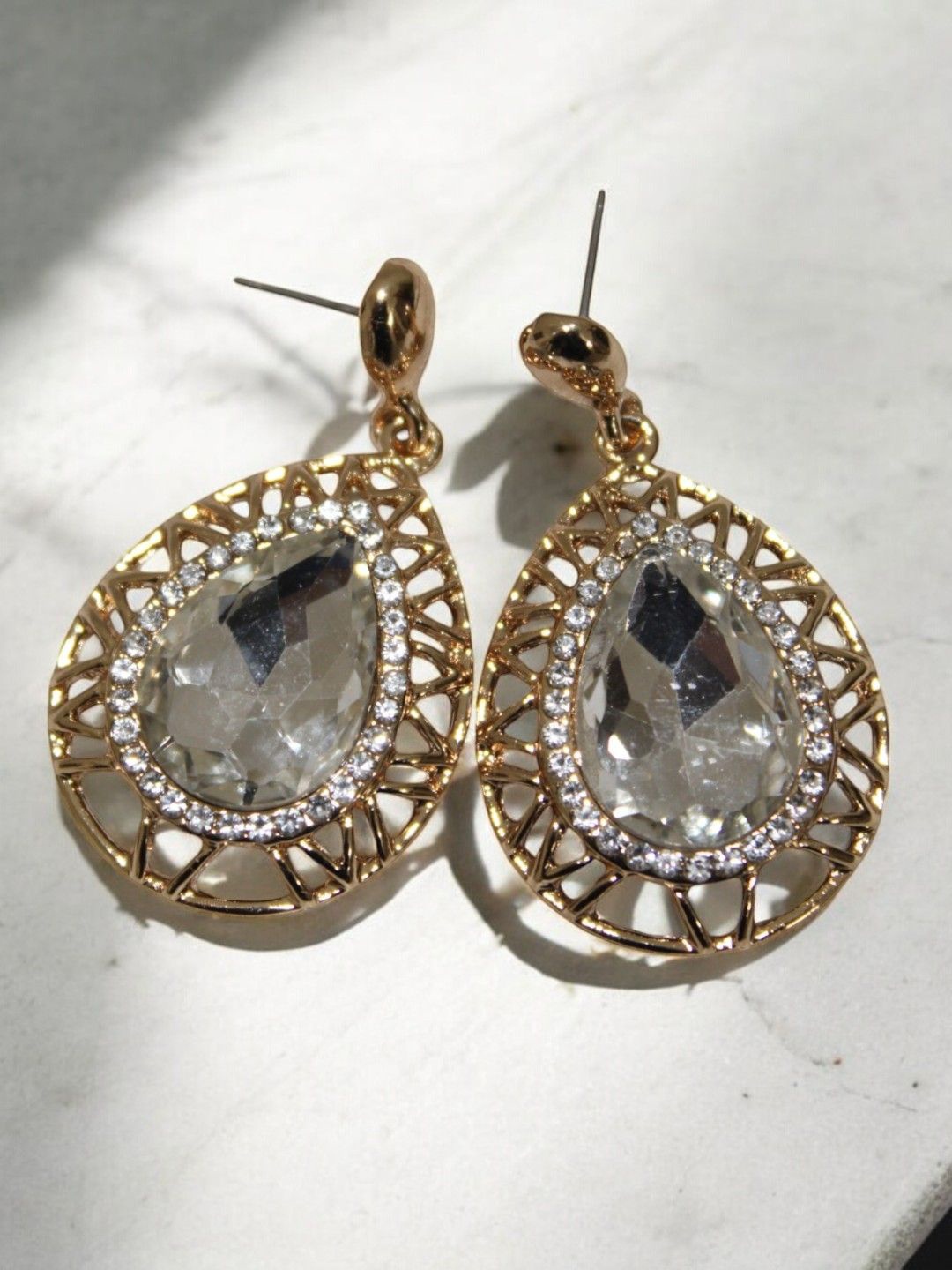 

Jolly Faces Gold-Plated Artificial Stones Studded Tear Drop Shaped Studs
