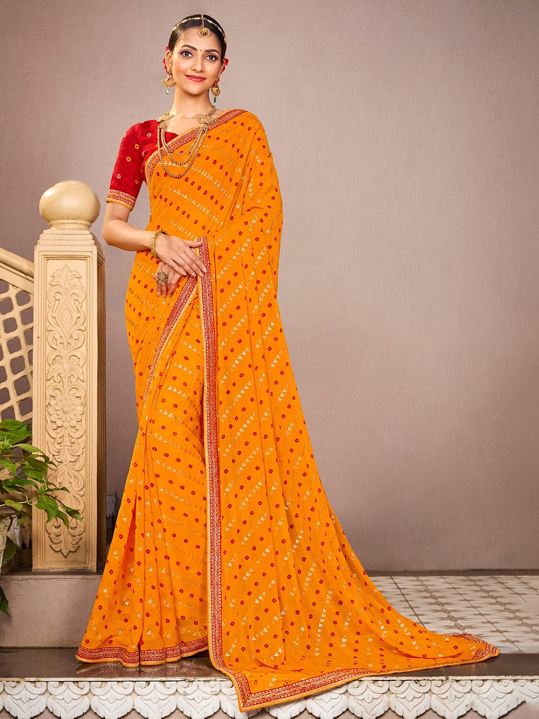 

Laxmipati Bandhani Printed Saree, Mustard