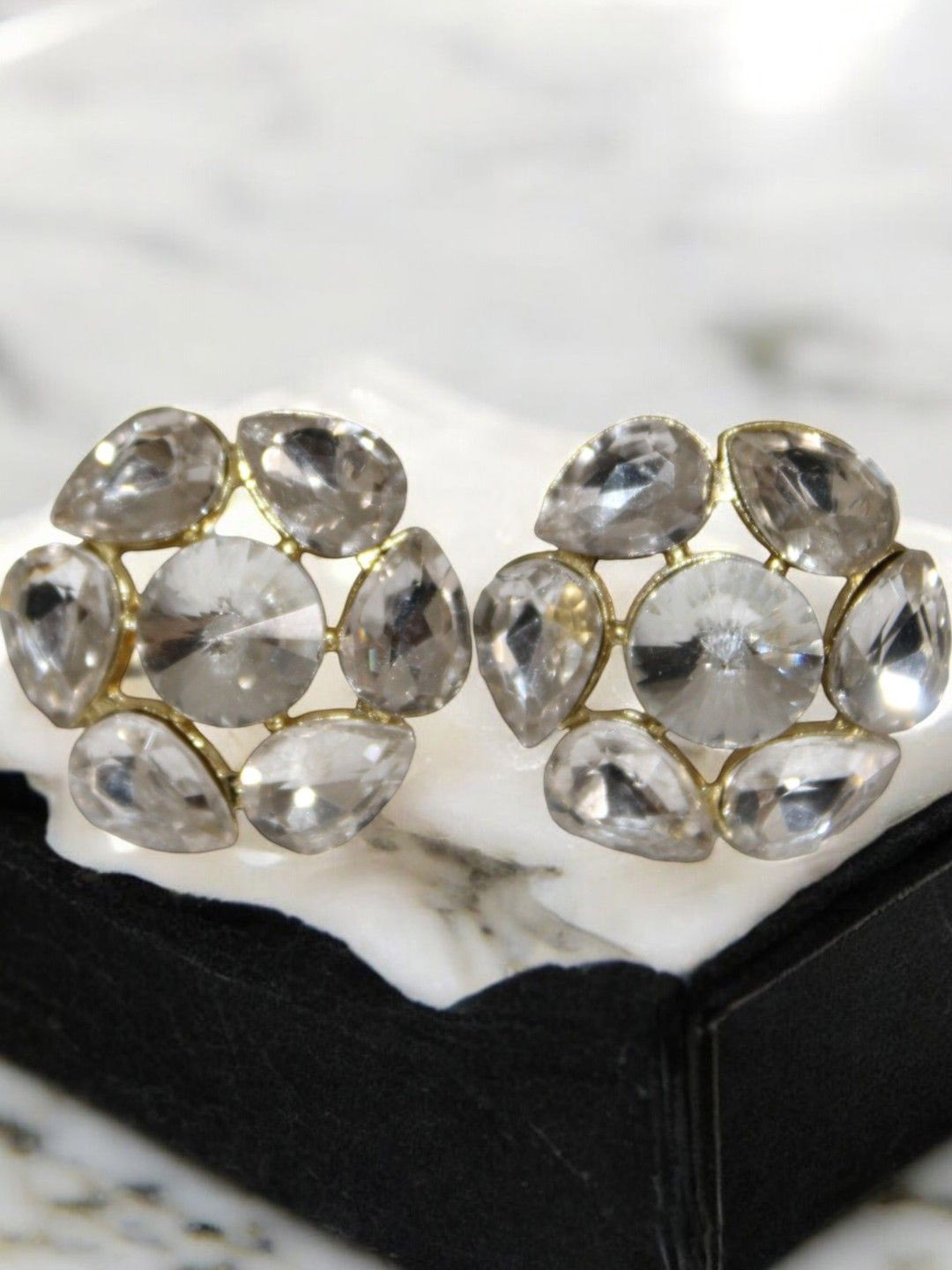 

Jolly Faces Artificial Stones Studded Floral Shaped Studs, Silver